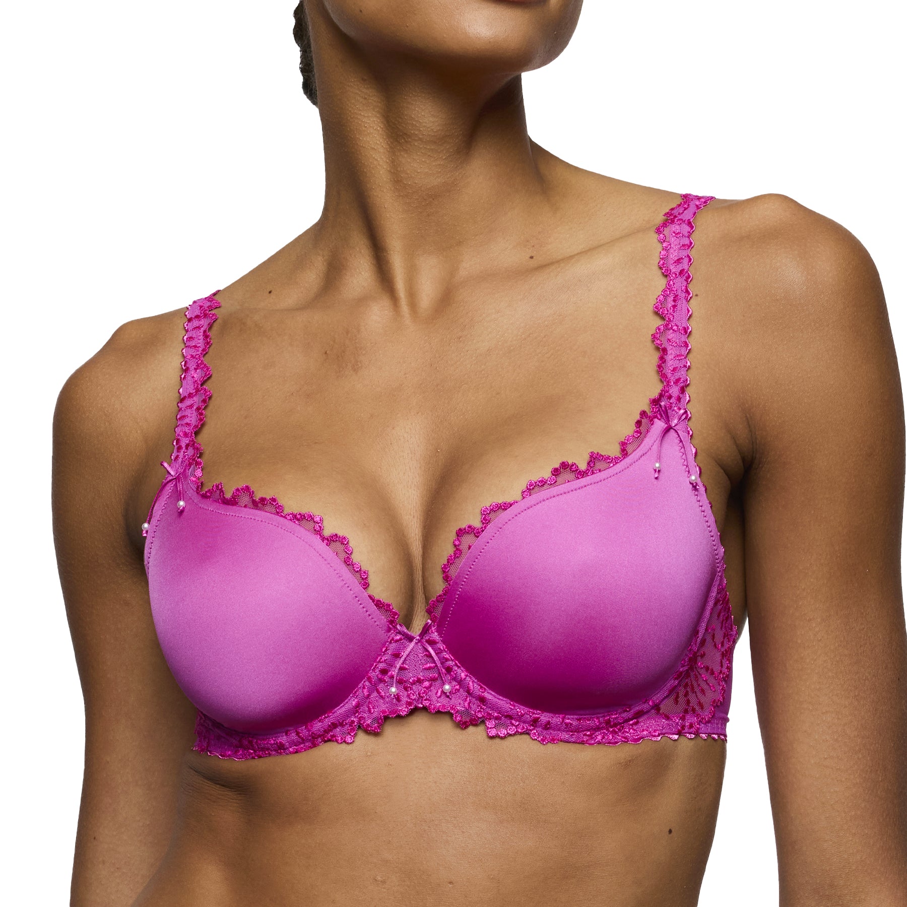 Close-up front view of fuchsia lace bra highlighting scalloped lace trim and supportive molded cups.