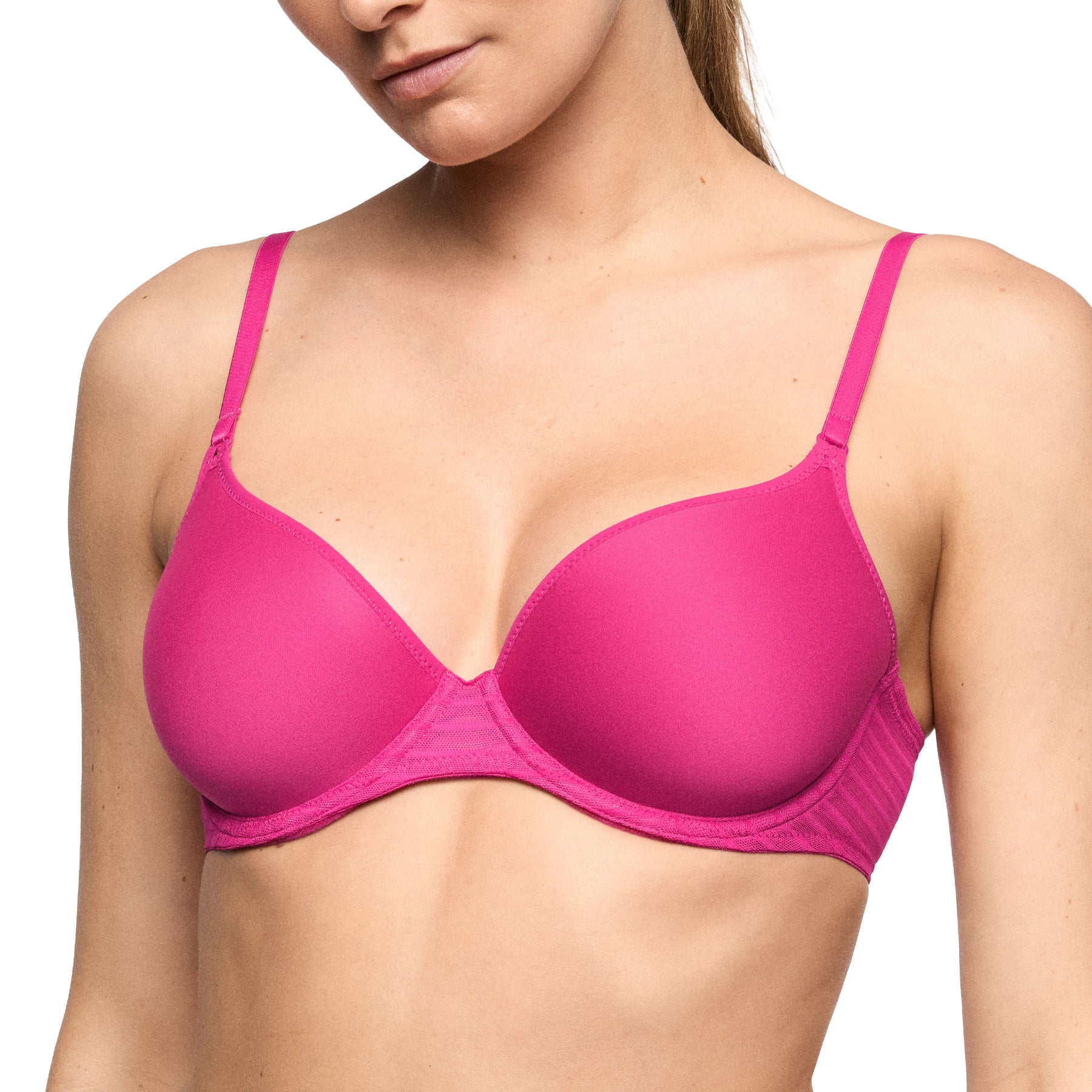Angled view of the very berry pink molded bra showcasing seamless cups, supportive underwire, and sheer striped mesh side panels.