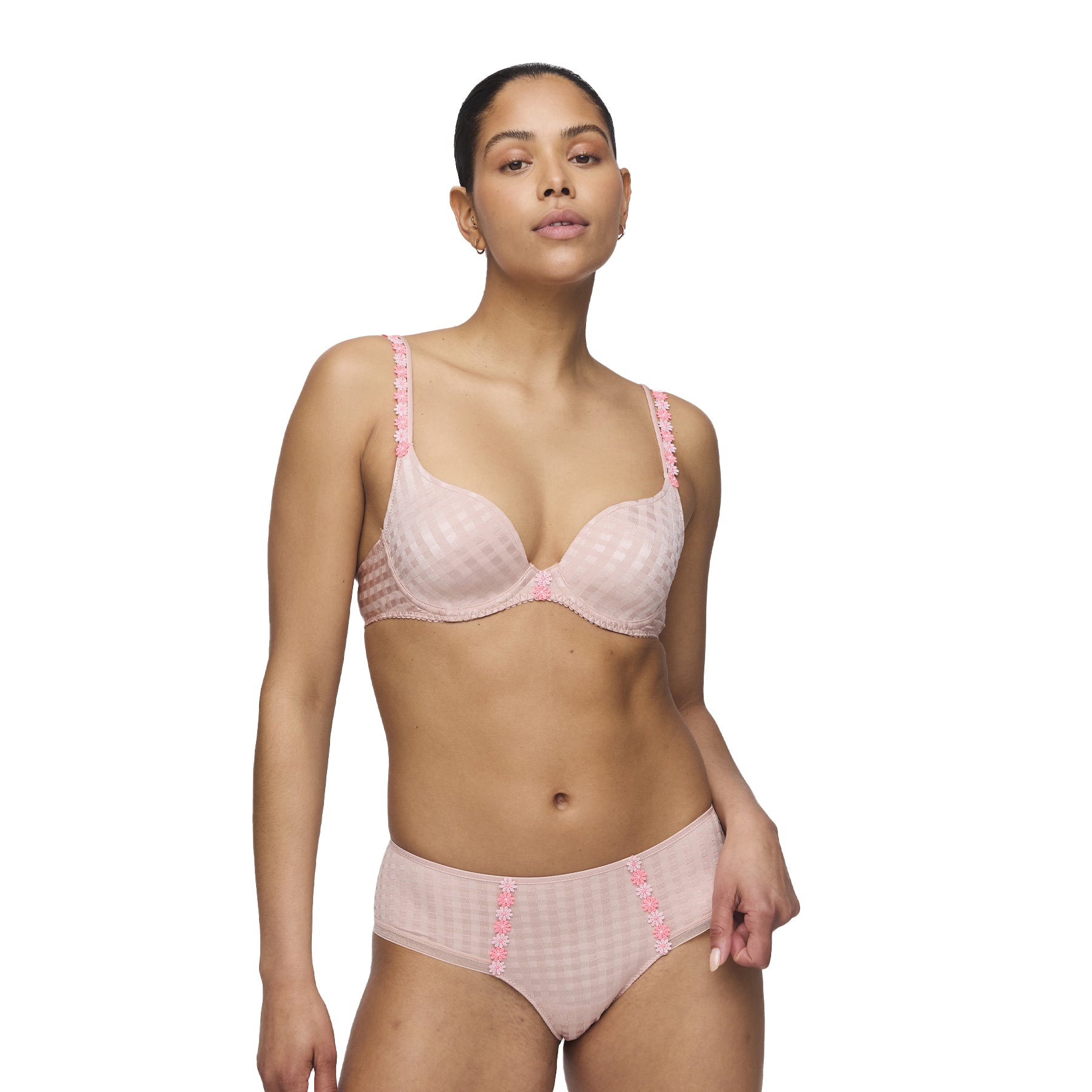 Model wearing a pastel pink gingham full cup bra and shorty with floral embroidery detail on straps and hips.