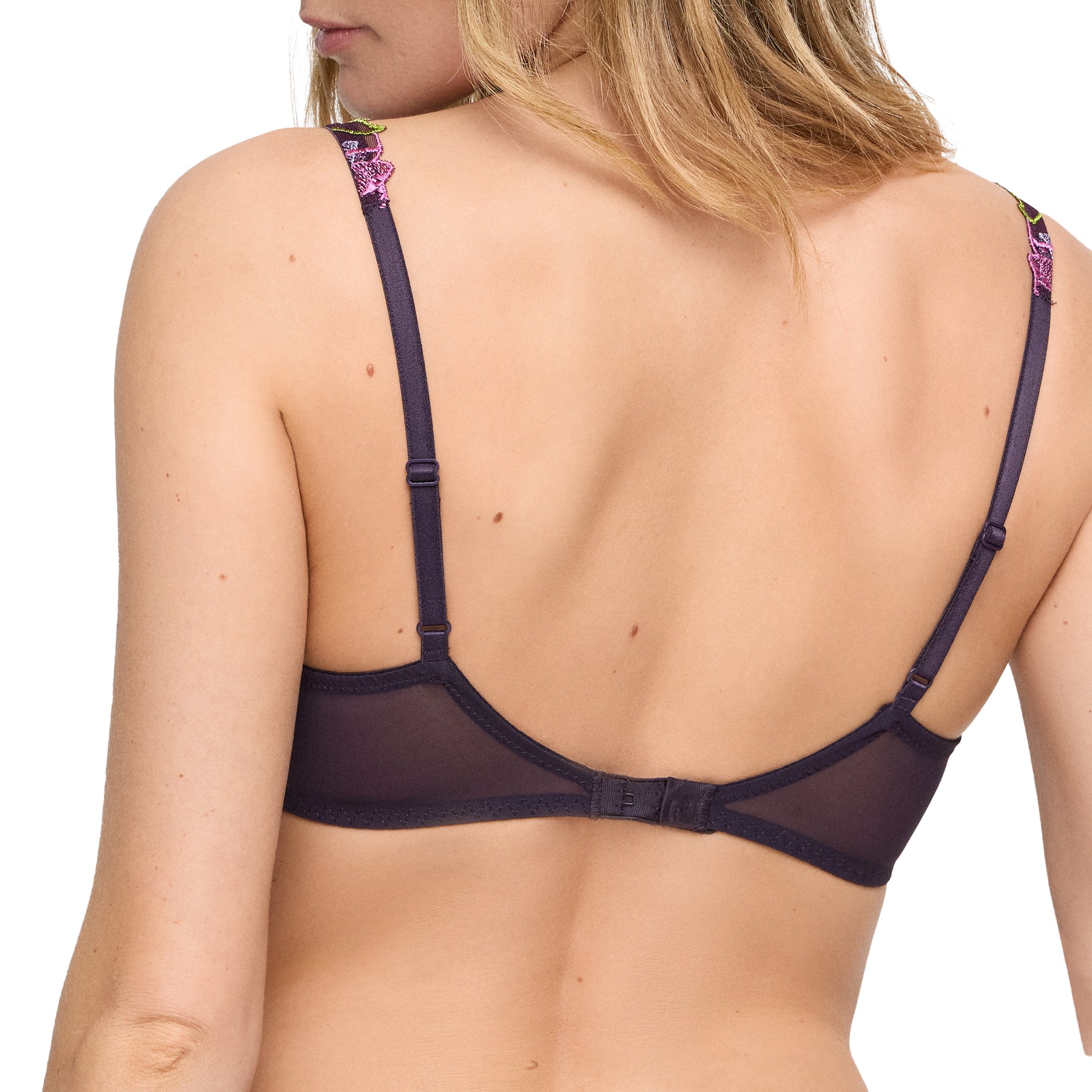 Model showcasing the sheer mesh back and adjustable straps of the embroidered plunge bra in dark purple