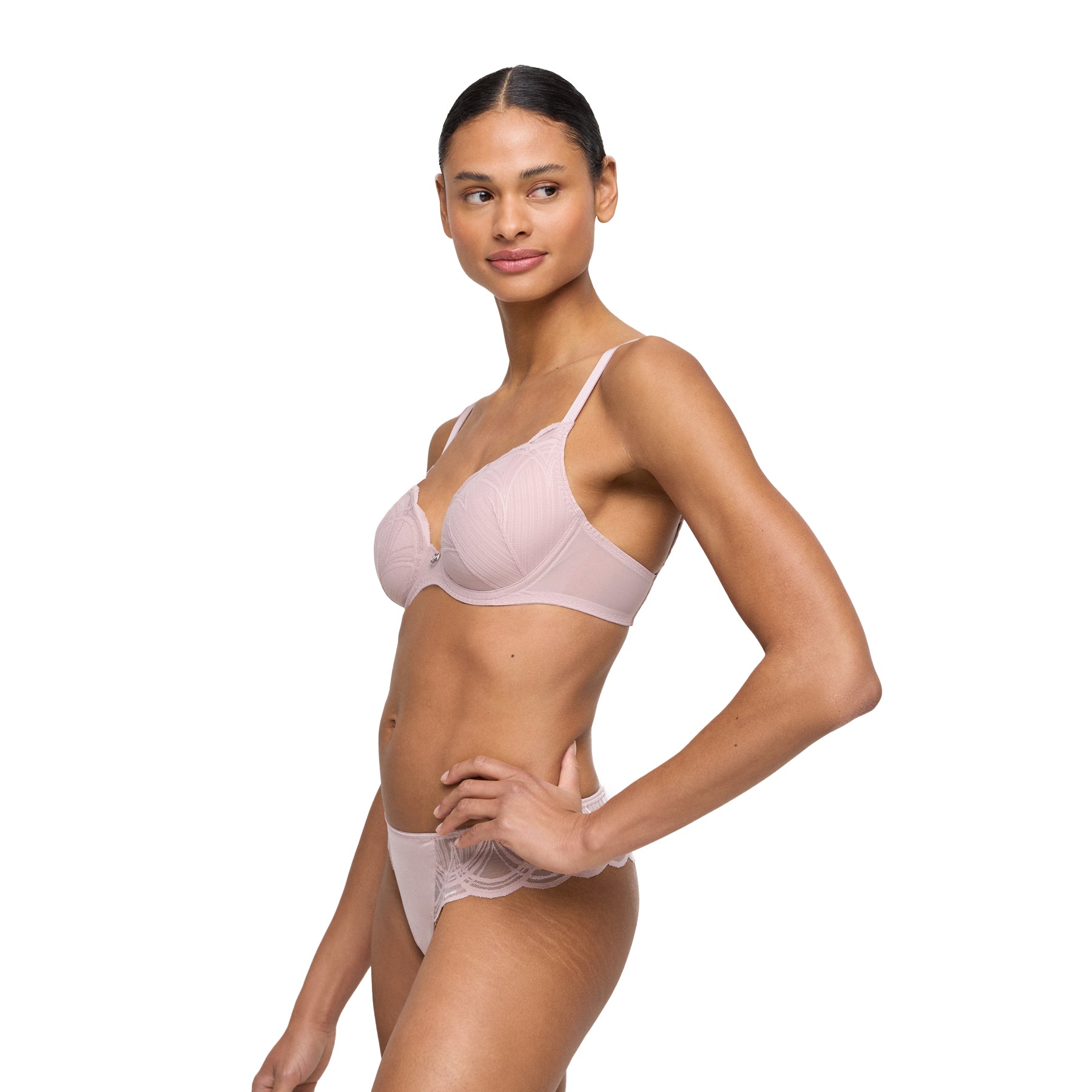Side view of woman wearing soft mauve padded lace bra and coordinating embroidered thong.