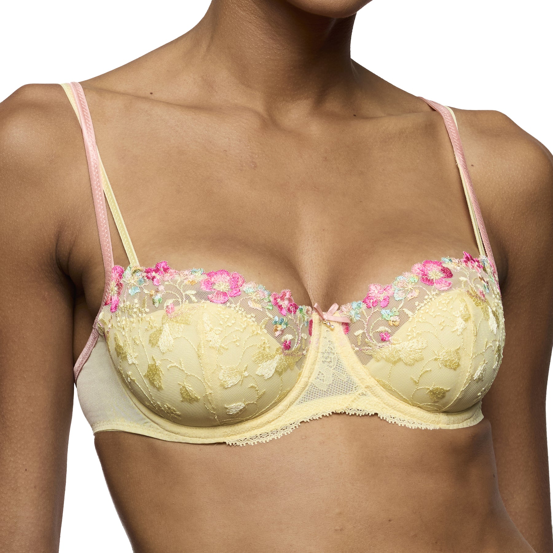 Close-up of French vanilla embroidered balconette bra with pastel floral lace and soft pink straps.