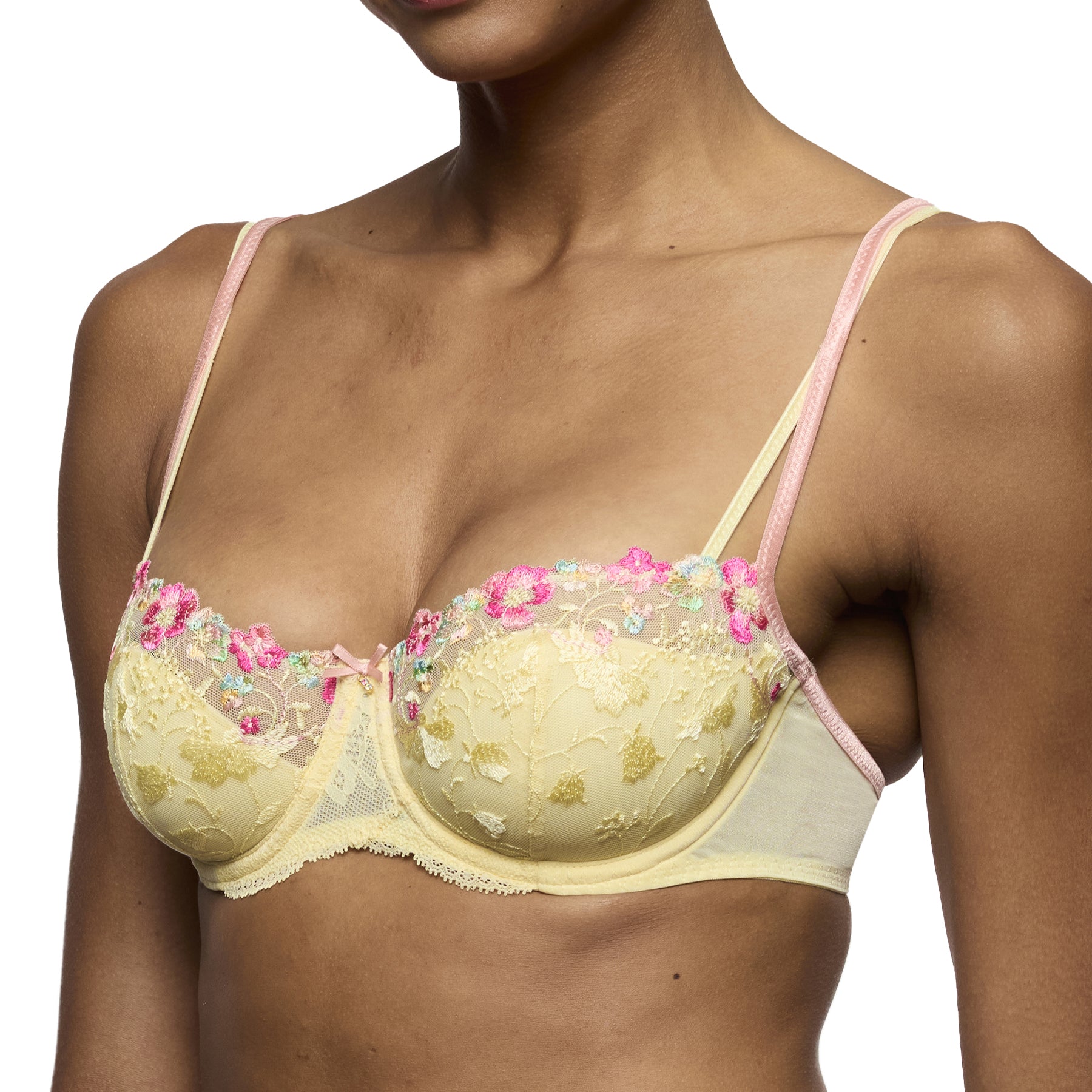 Side angle of French vanilla lace underwire bra with sheer mesh side panel and pink strap detailing.