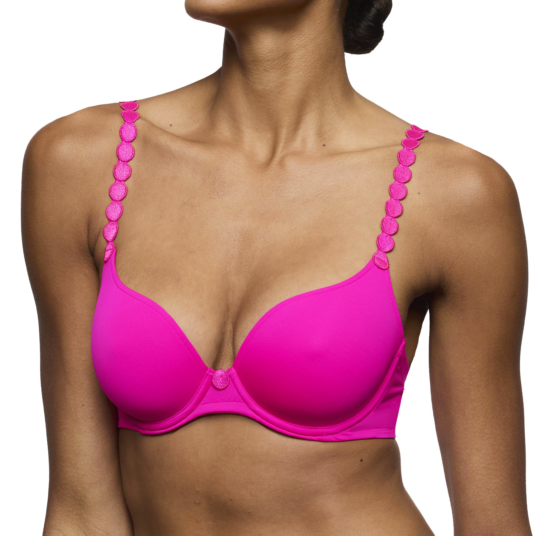 Front view of fuchsia pink underwire bra with smooth cups and statement strap detailing, worn by a model.