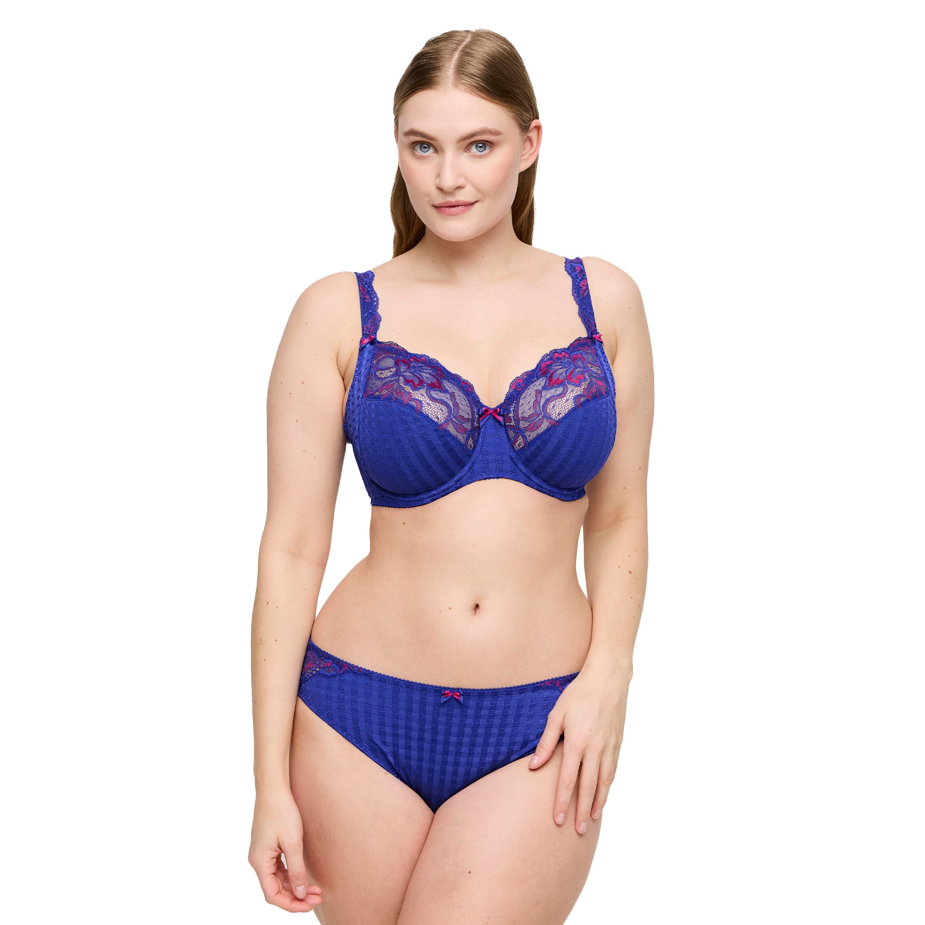 Woman wearing a blue full cup bra with fuchsia floral lace and matching brief.