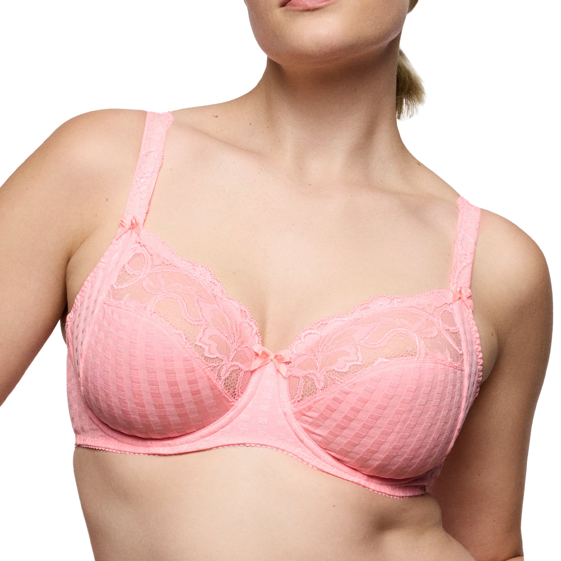 Close-up of pink lace underwire bra with sheer floral lace and structured cups