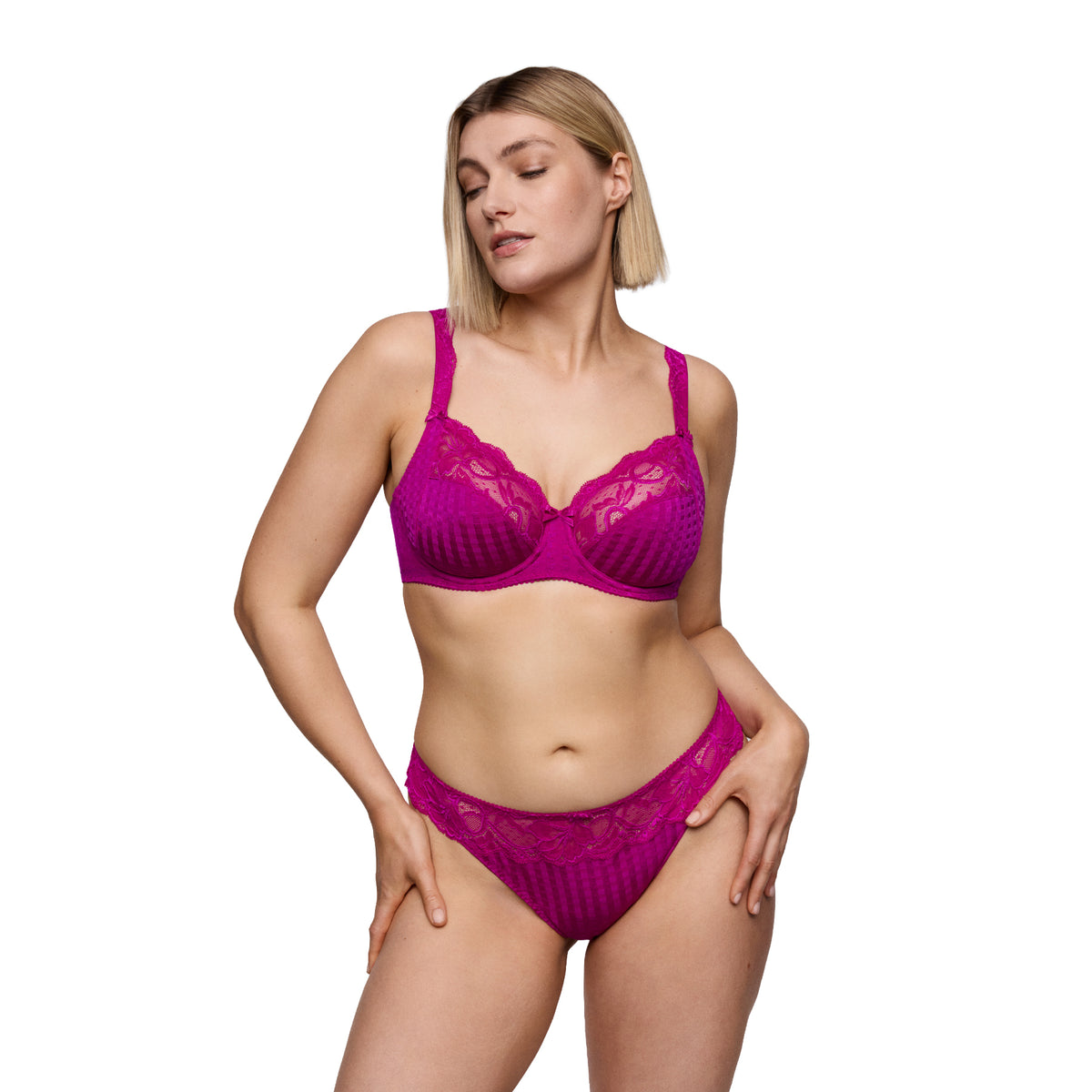 Model wearing the PrimaDonna Madison bra and matching brief in vibrant Wild Rose pink with signature checkered fabric and floral lace.