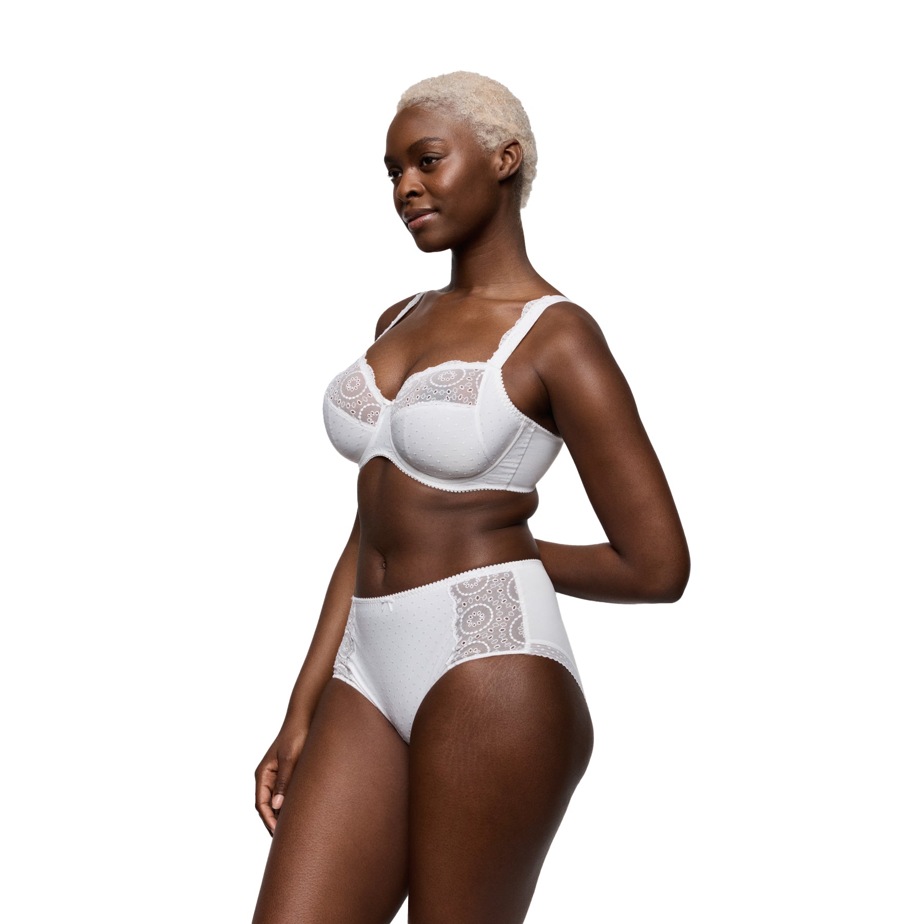 Model wearing white full cup bra and matching brief style 016-3310 featuring delicate lace embroidery and dotted mesh panels.