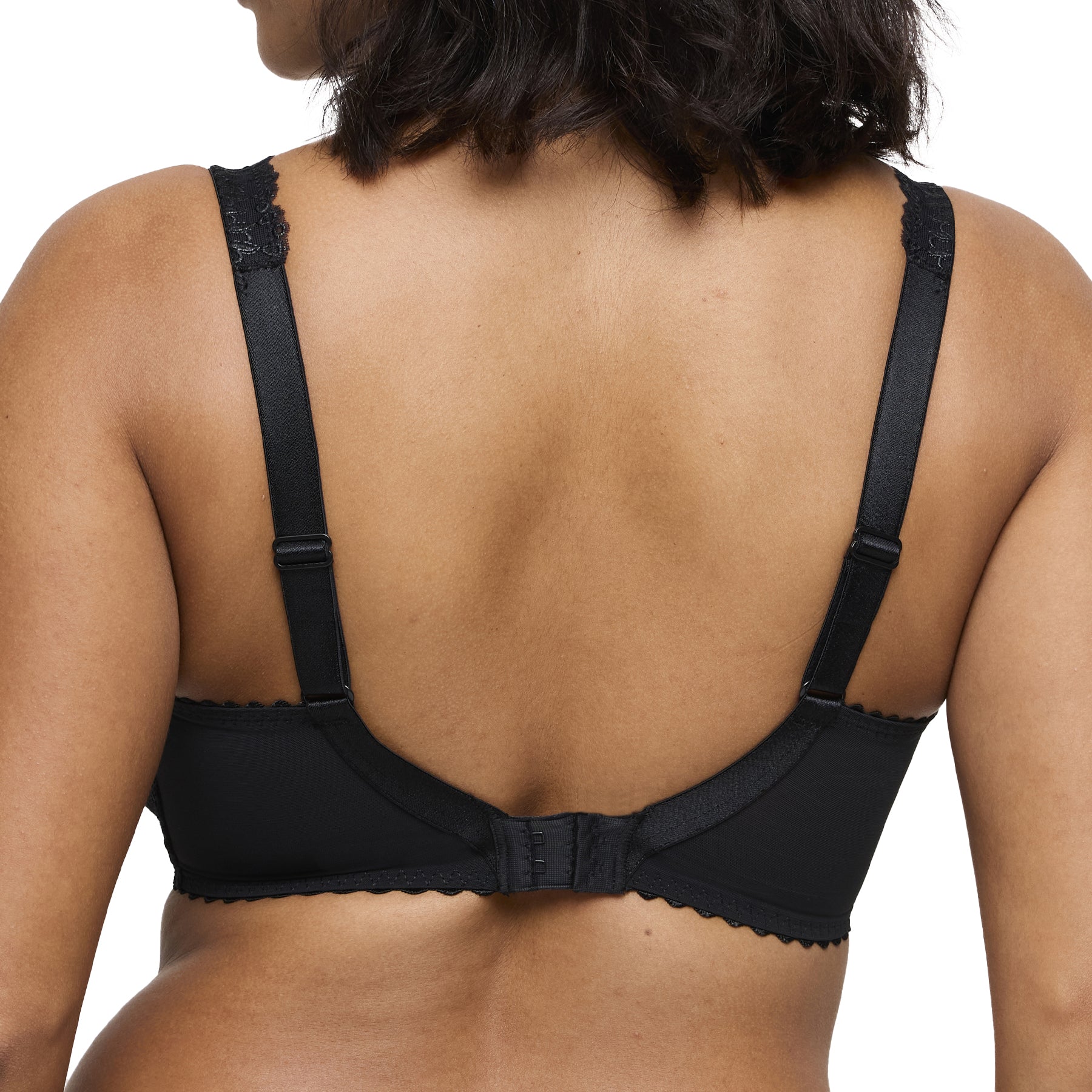 Back view of black lace bra with adjustable straps and hook-and-eye closure.