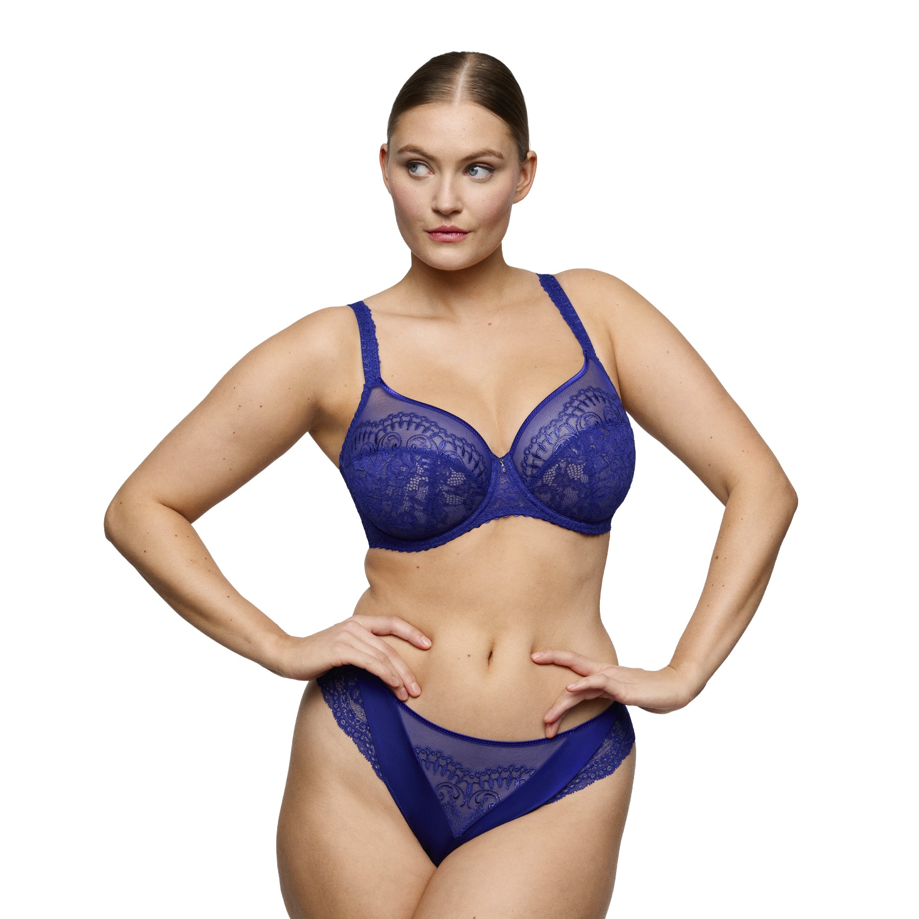 PrimaDonna balcony bra in Crazy Blue lace with sheer embroidered cups, worn with matching briefs.