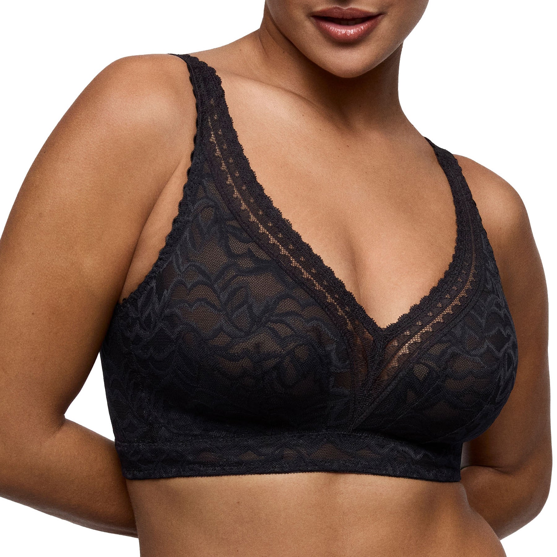 Front view of model wearing PrimaDonna Miyara wireless black lace bra with a flattering deep V-neckline.