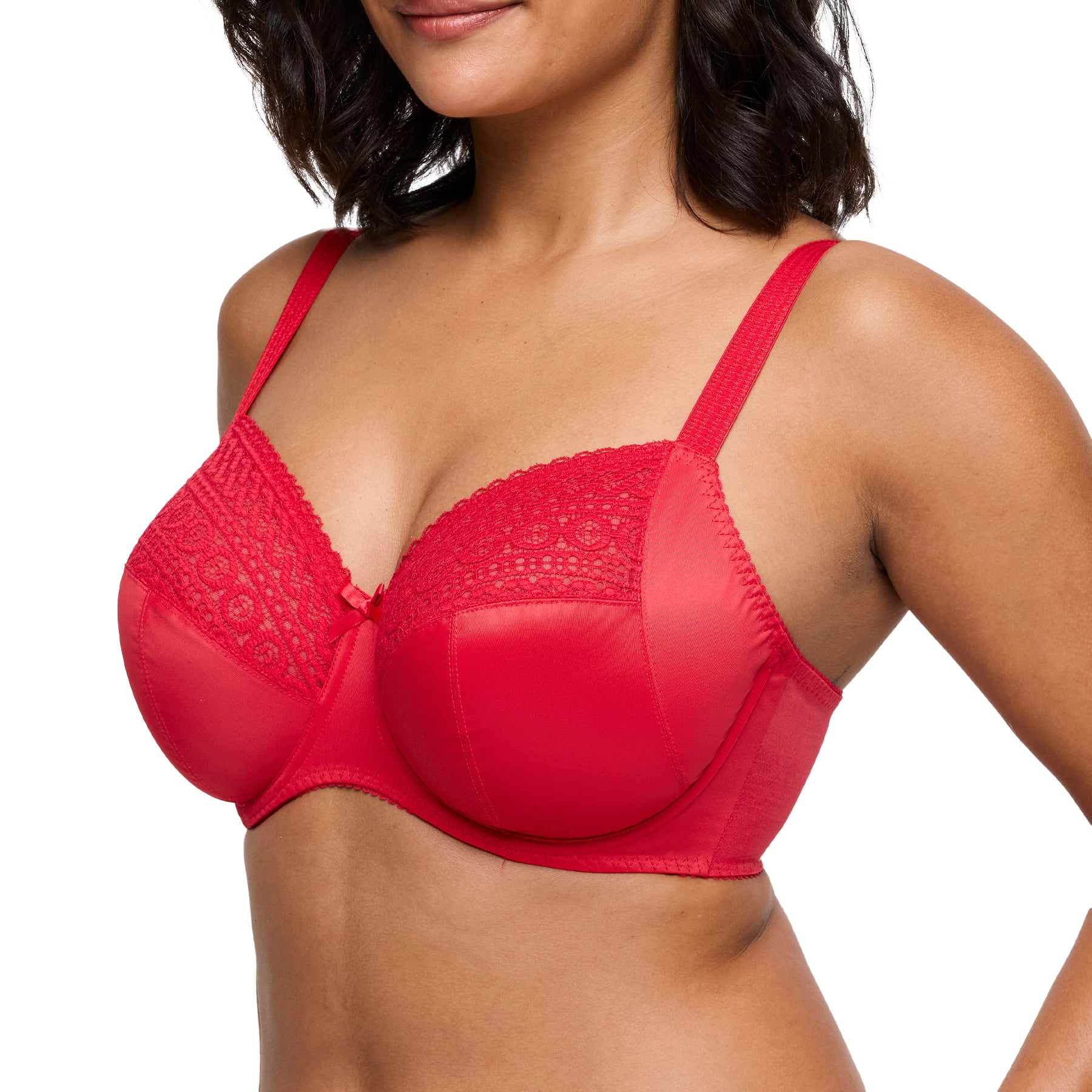 Side view of a woman wearing a red lace full cup bra with supportive straps.