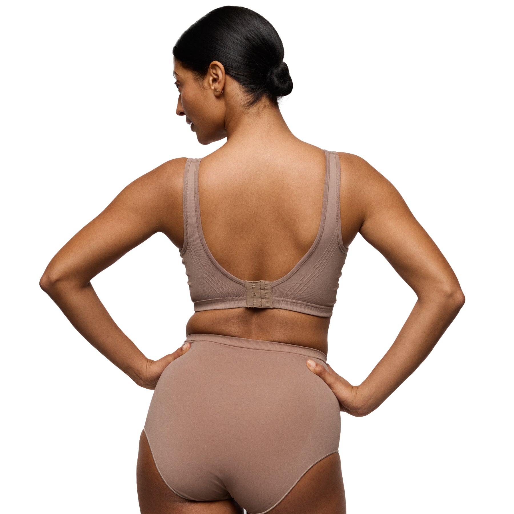 Back view of mocha seamless wireless bra with hook-and-eye closure and supportive wide band