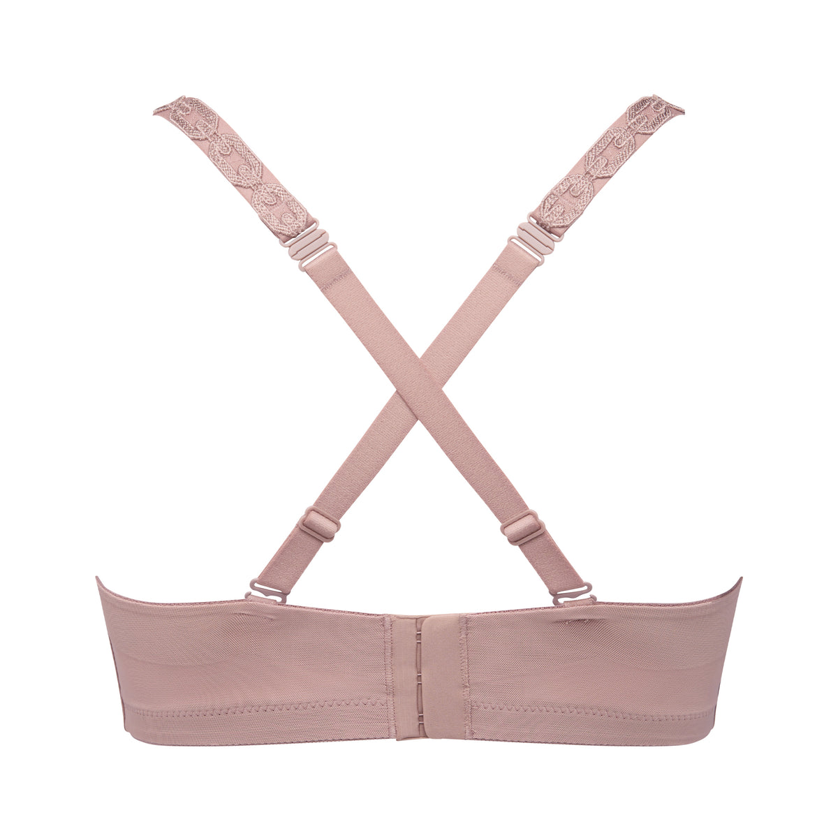 Strapless Twist bra in Cosmetic with smooth molded cups and removable straps styled in a cross-back position.