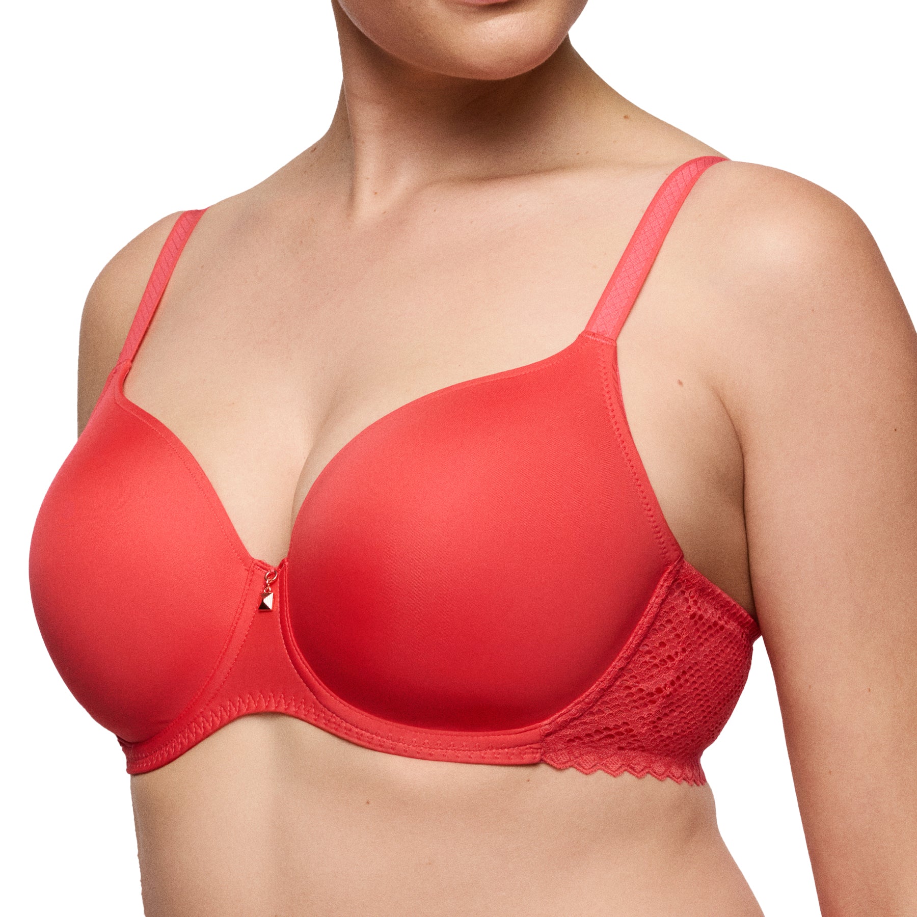 Angled side view of a coral full-coverage bra on model, showing smooth cups and textured lace band at the sides.