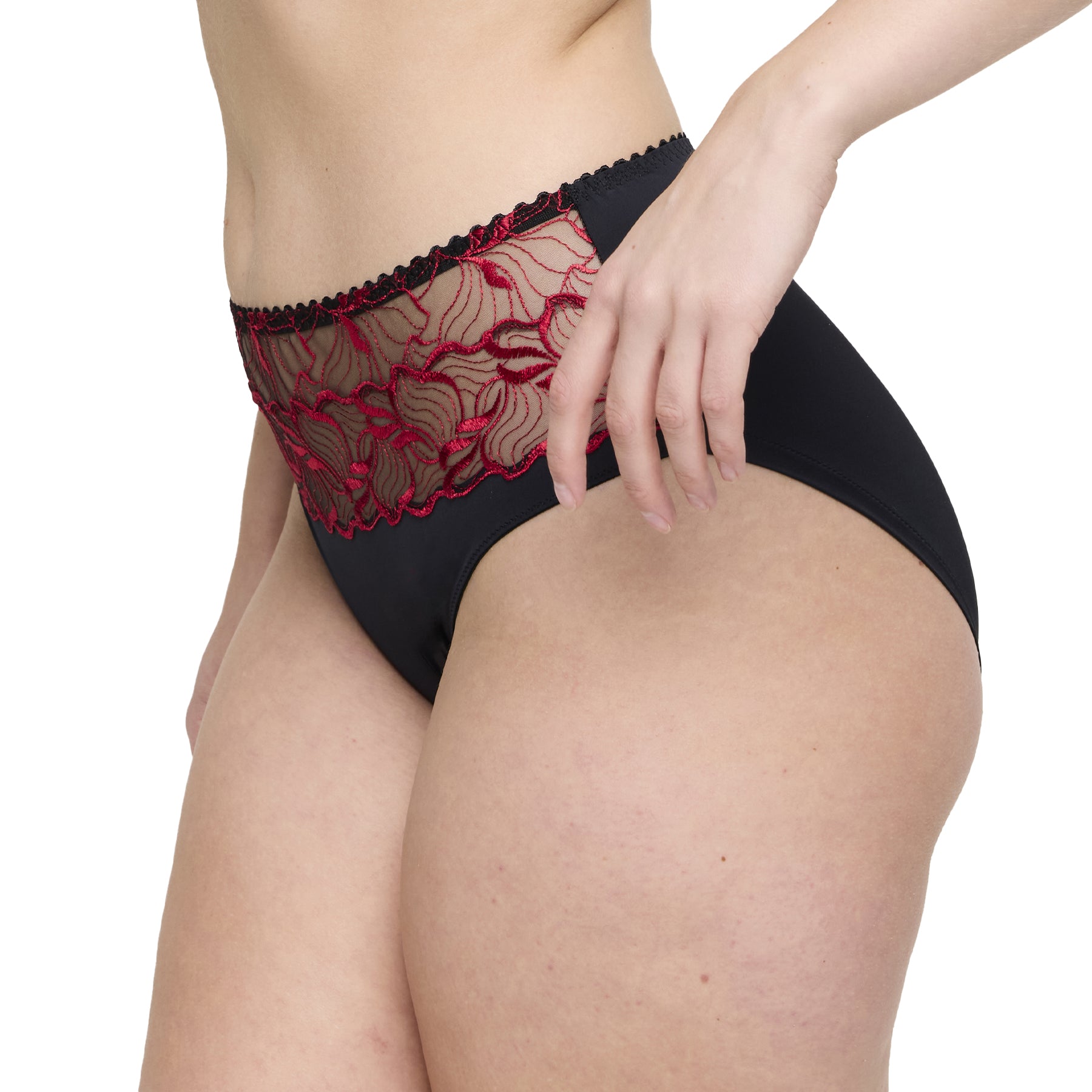 Side view of black high-waist brief with red floral lace embroidery and semi-sheer upper panel.
