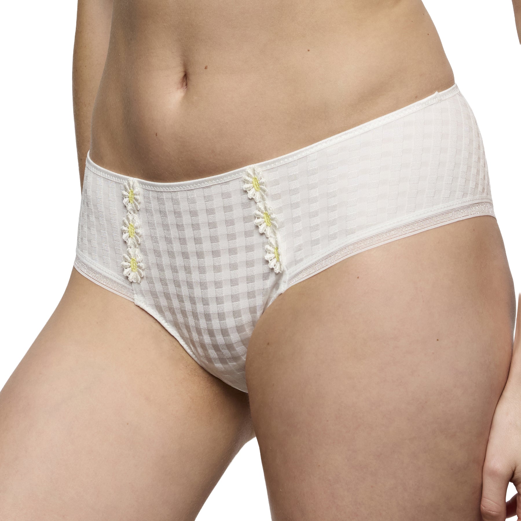 Angled front close-up of ivory briefs highlighting the check-textured fabric and embroidered daisy details.