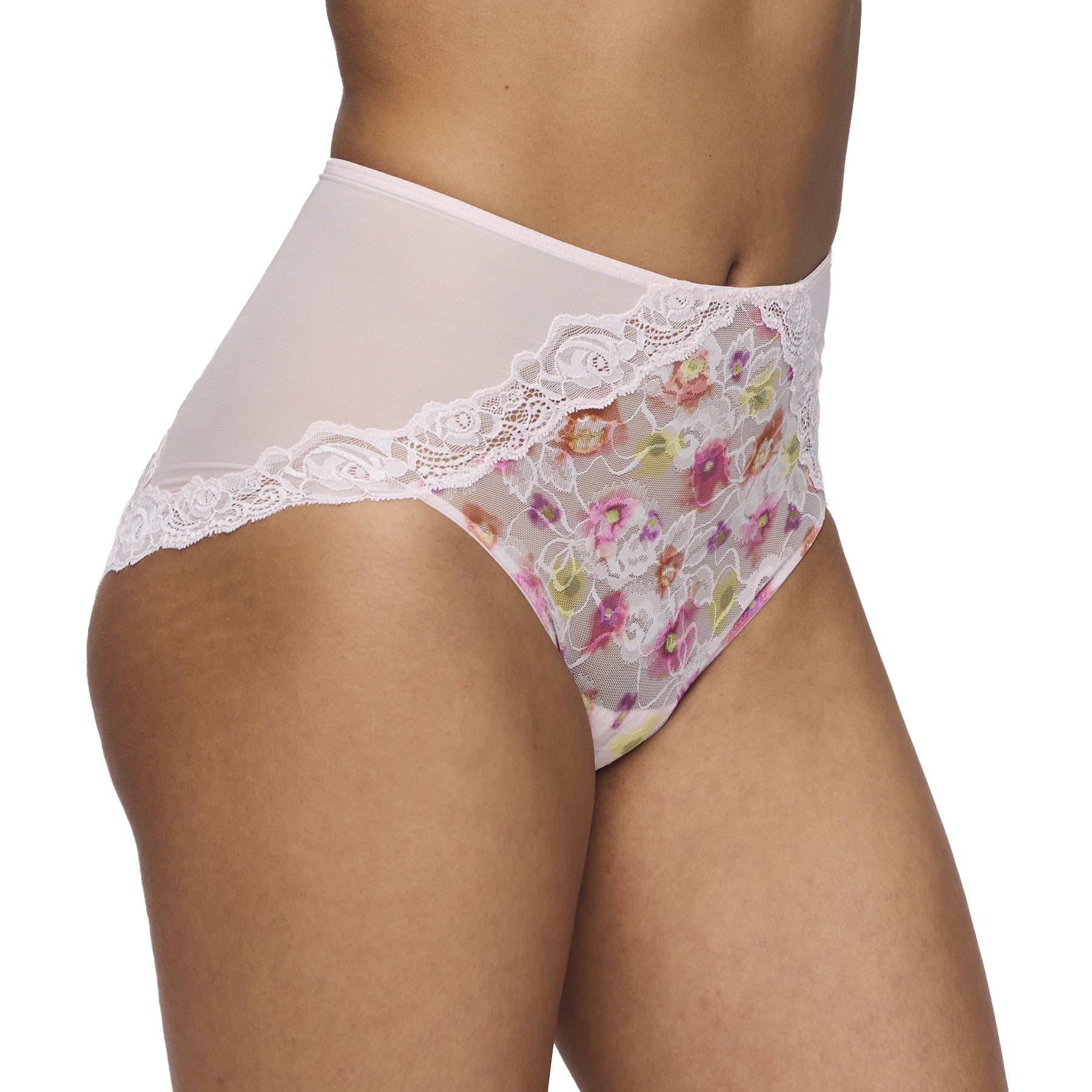 Side view of a woman wearing the floral Selyna full brief, highlighting the contrast between the sheer front panel and the smooth microfiber sides.