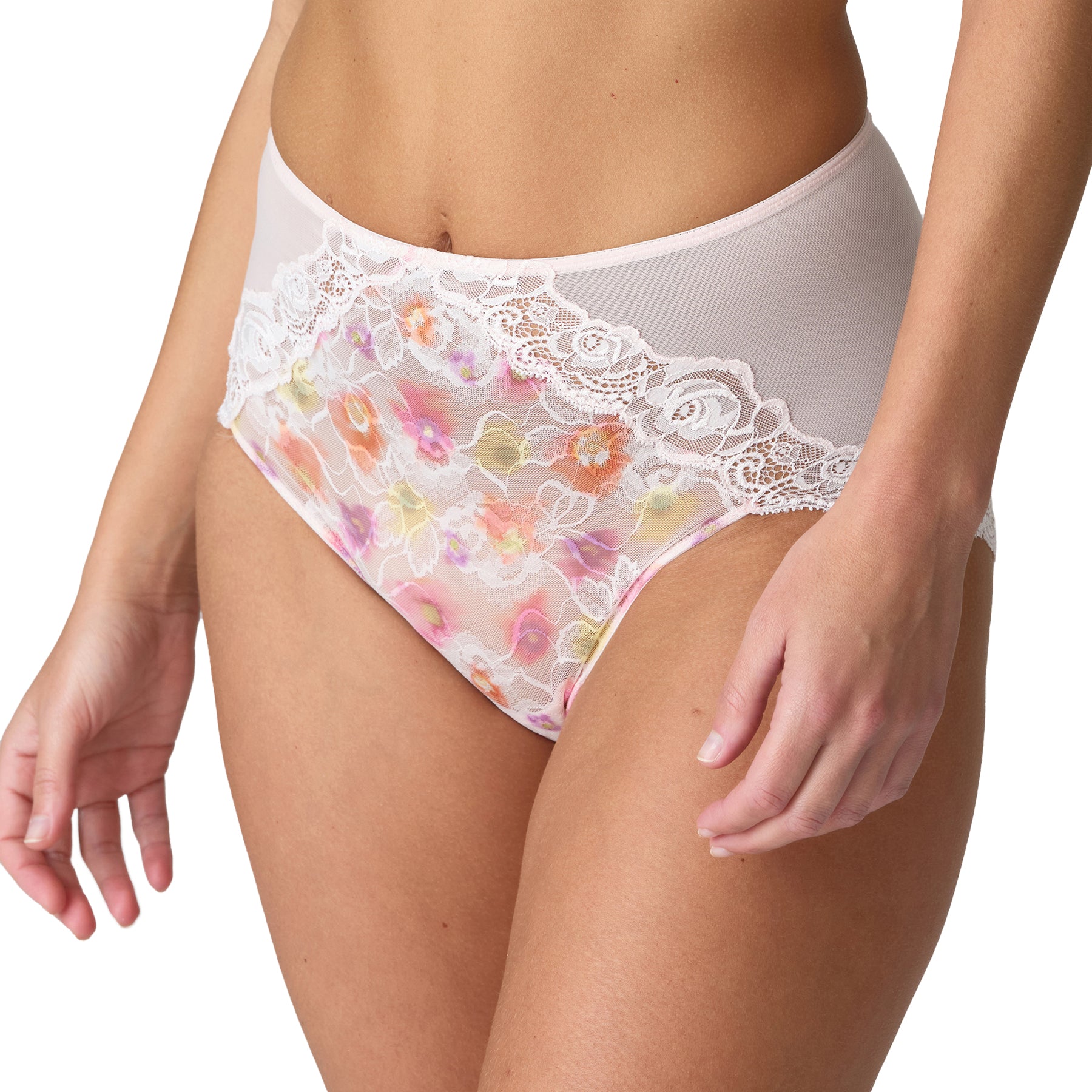 Close-up front angle of a woman wearing the Selyna full brief, displaying the floral mesh and delicate lace detailing.