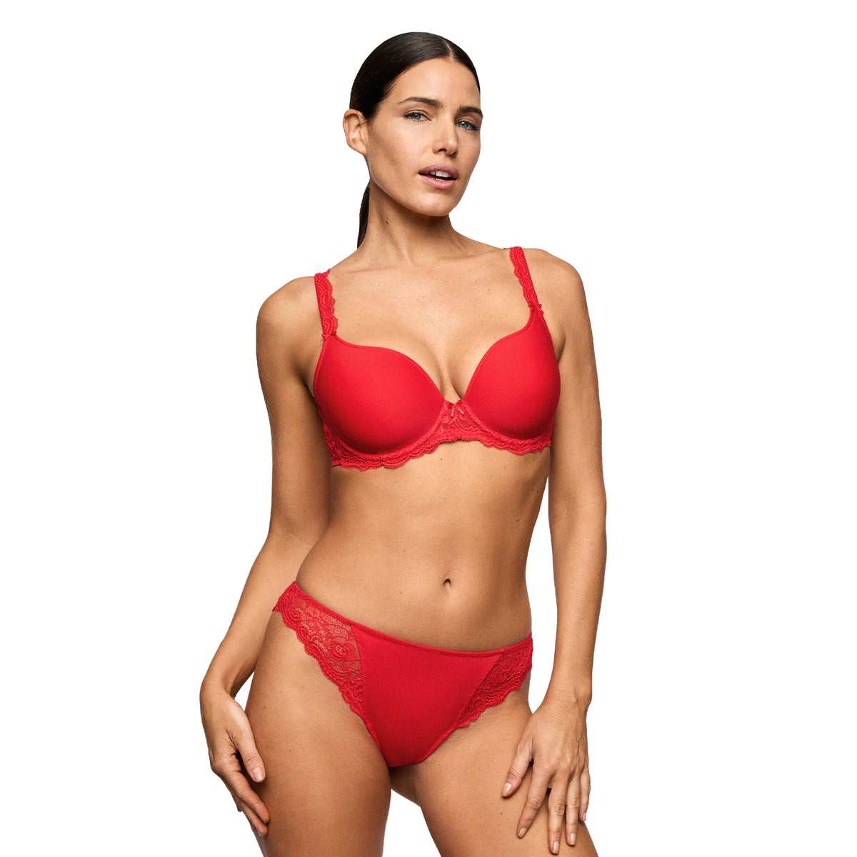 Model wearing a True Red bikini brief with delicate floral lace sides and matching red bra.