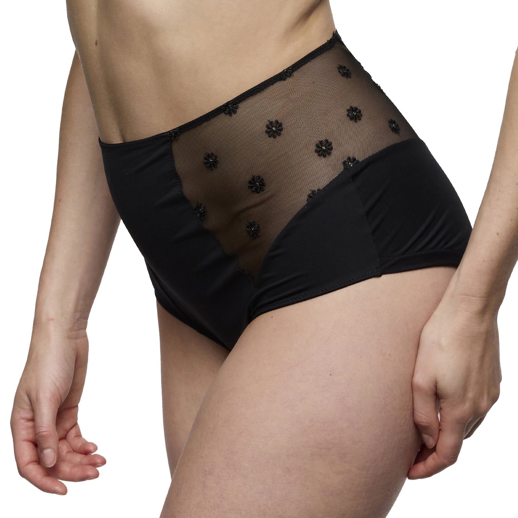 Side view of a black high-waisted brief showing the contrast between smooth fabric and sheer embroidered mesh panel.