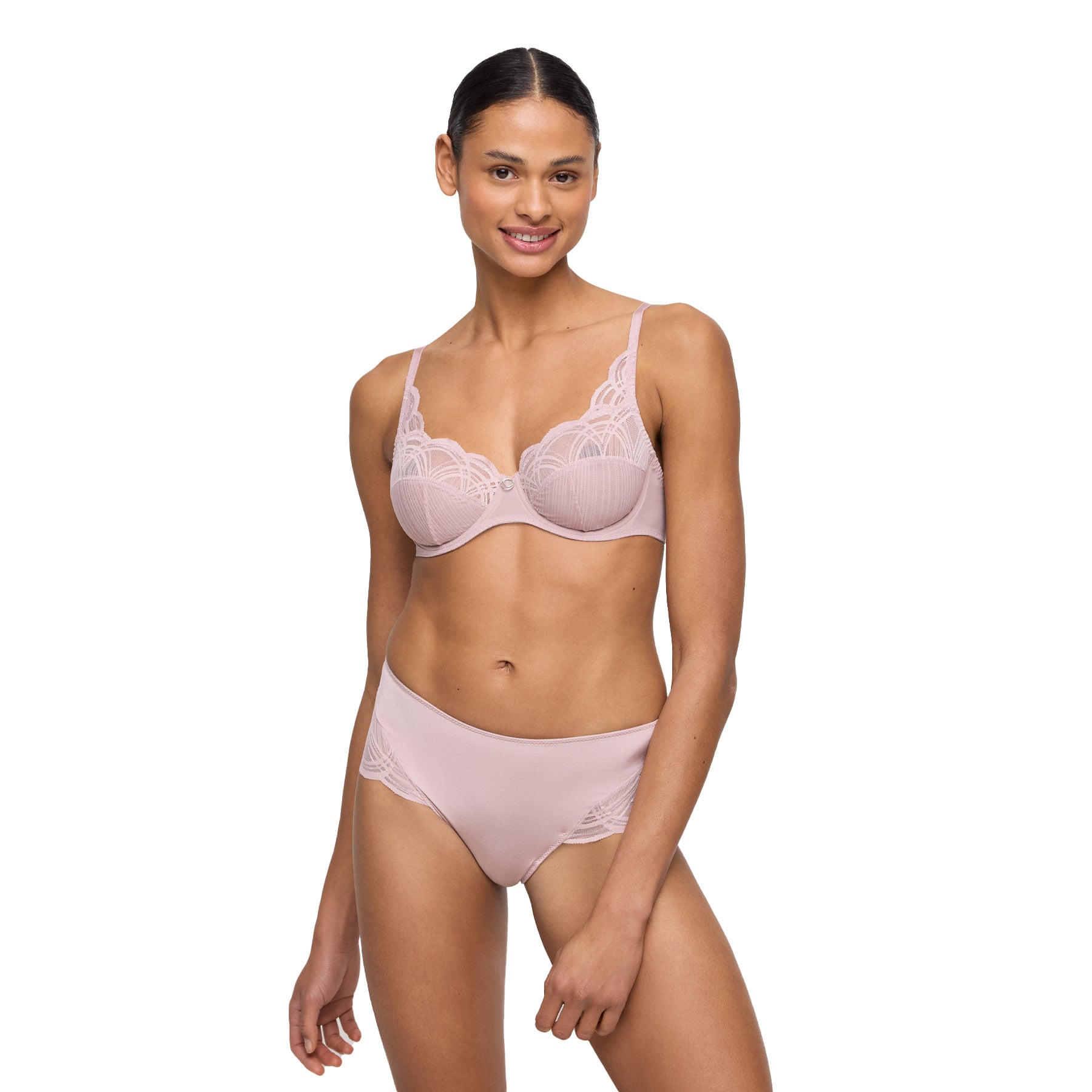 Woman in mauve lace lingerie set featuring a full coverage brief with mesh and embroidery accents at the sides.