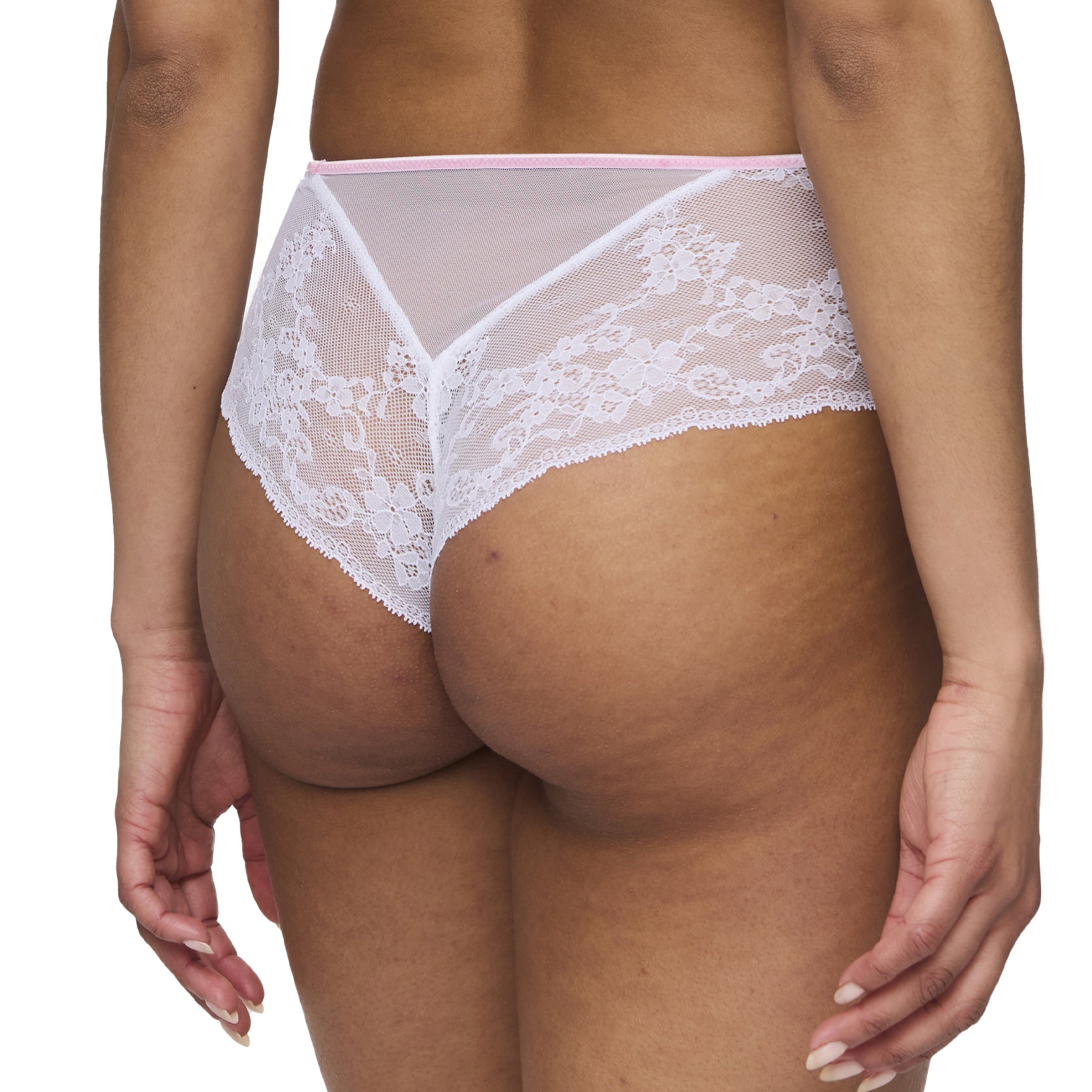 Back view of a model wearing the lace panty, showcasing the sheer lace design and scalloped edges for a feminine and elegant look.