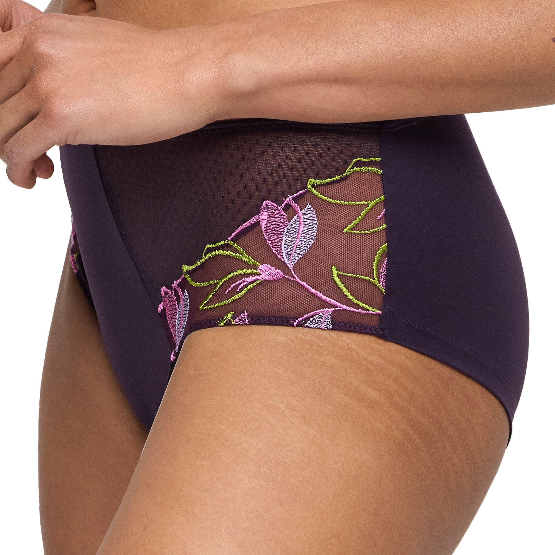 Side close-up of plum high-waisted brief with sheer mesh and detailed pink and green floral embroidery