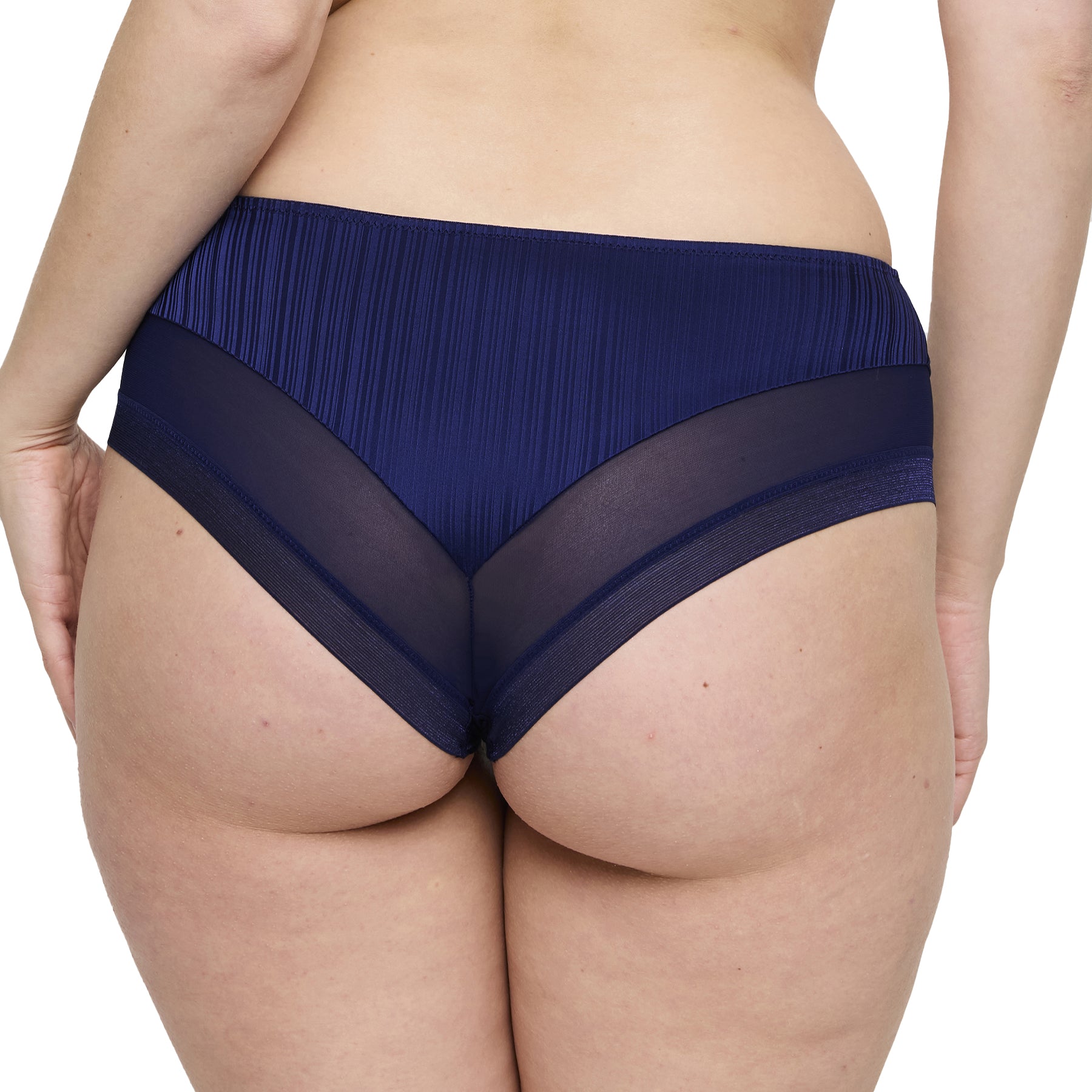 Back view of woman wearing sapphire blue panties with pleated satin fabric and sheer mesh detailing.