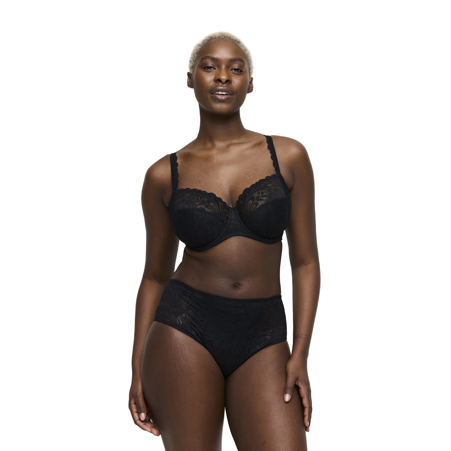 Woman wearing black lace bra and high-waist lace briefs set, front view.