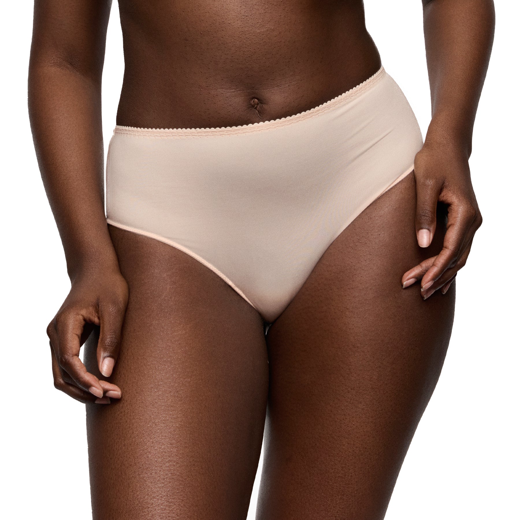 Front view of a nude high-rise full brief worn by a model, highlighting the smooth fit and full coverage.