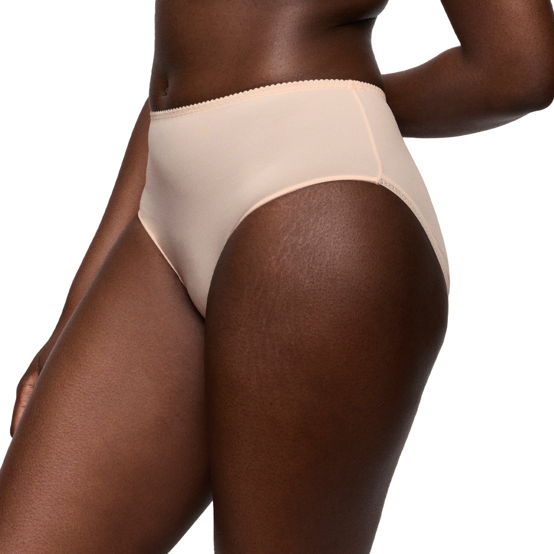 Side view of a nude high-waisted full brief on a model, showing the clean leg opening and smooth, flattering silhouette.