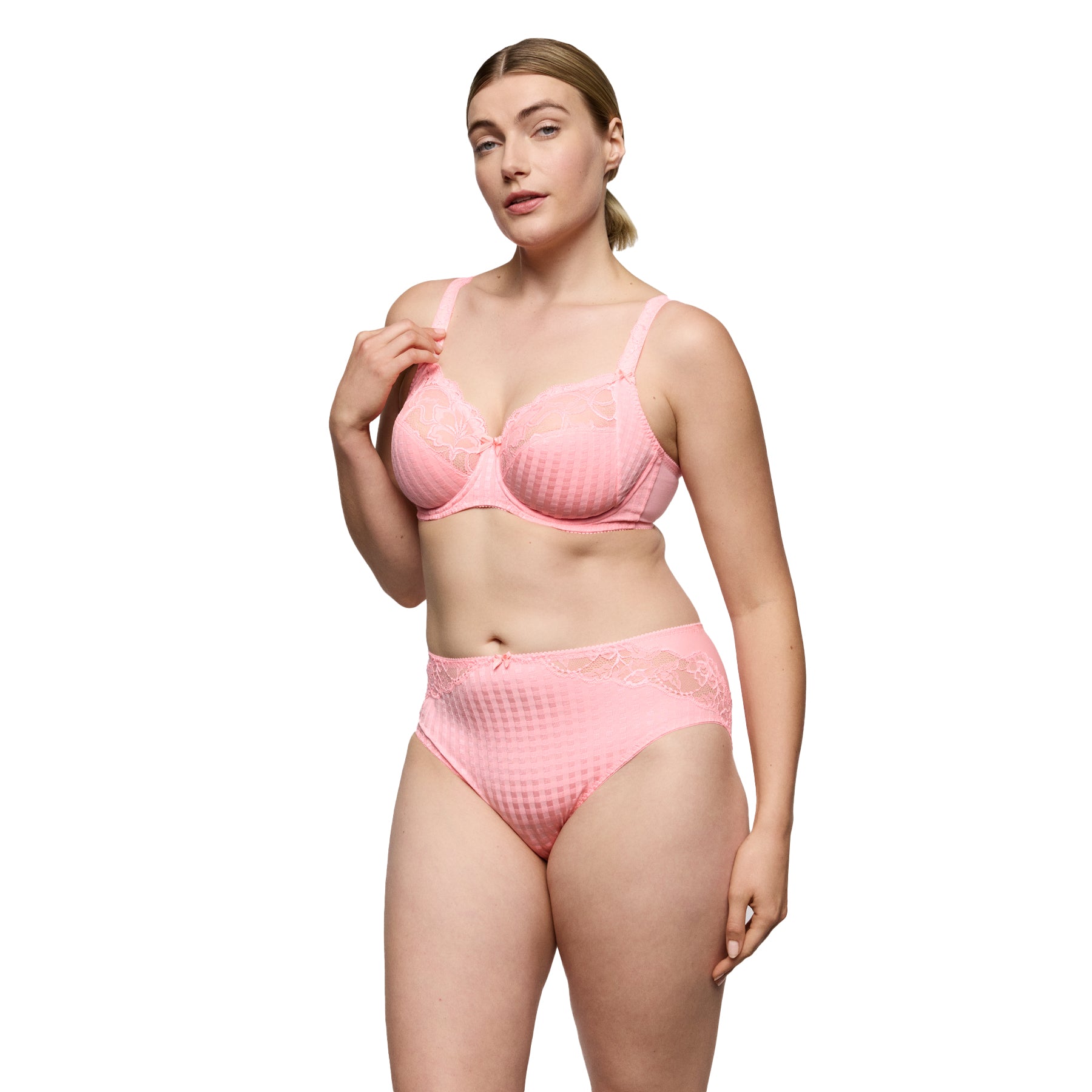 Woman wearing pink lace underwire bra with matching high-waist brief featuring textured check pattern