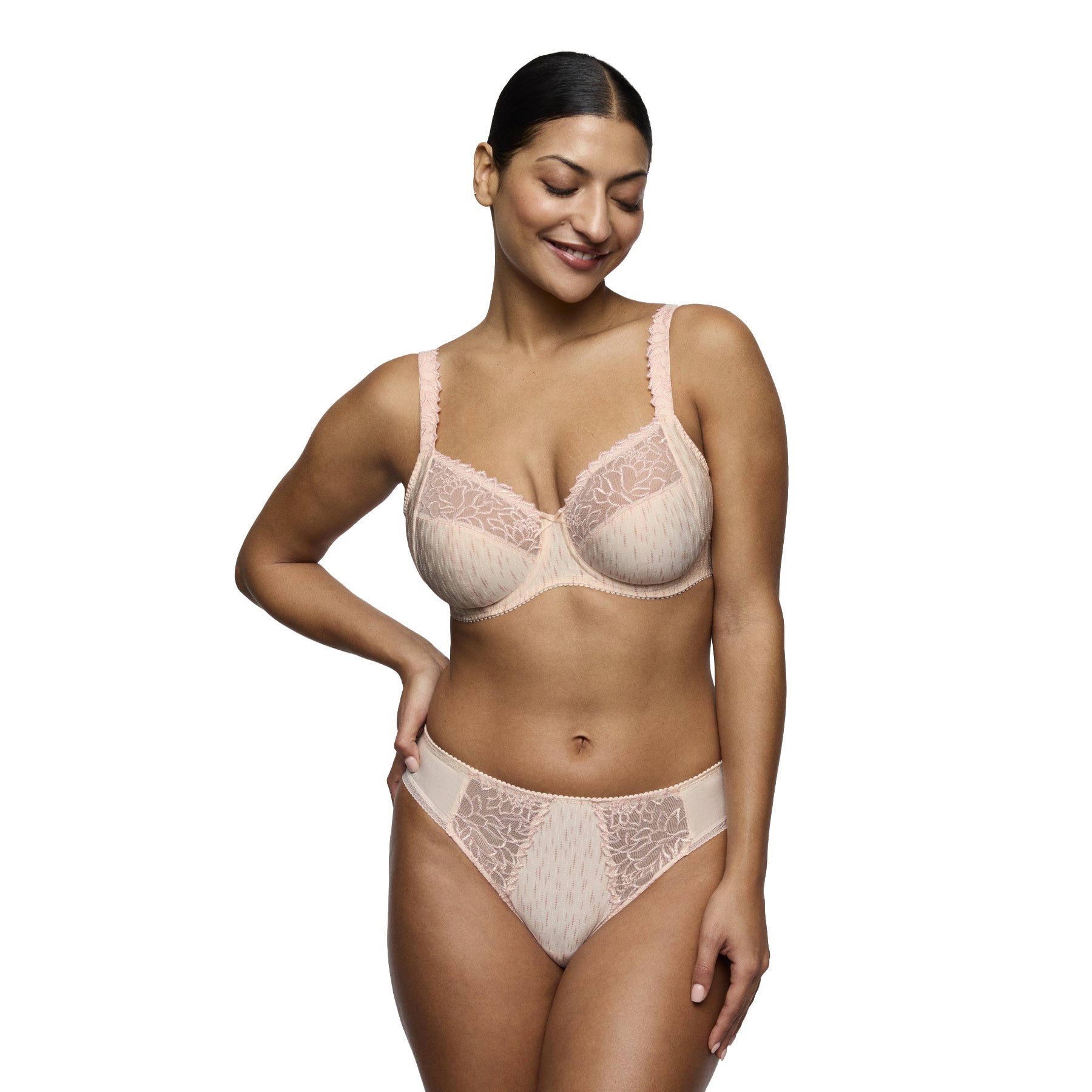 Model wearing the PrimaDonna Monterrey Rio Brief and matching full cup bra in Venus, showcasing a soft blush design with floral lace panels and a flattering mid-rise fit.