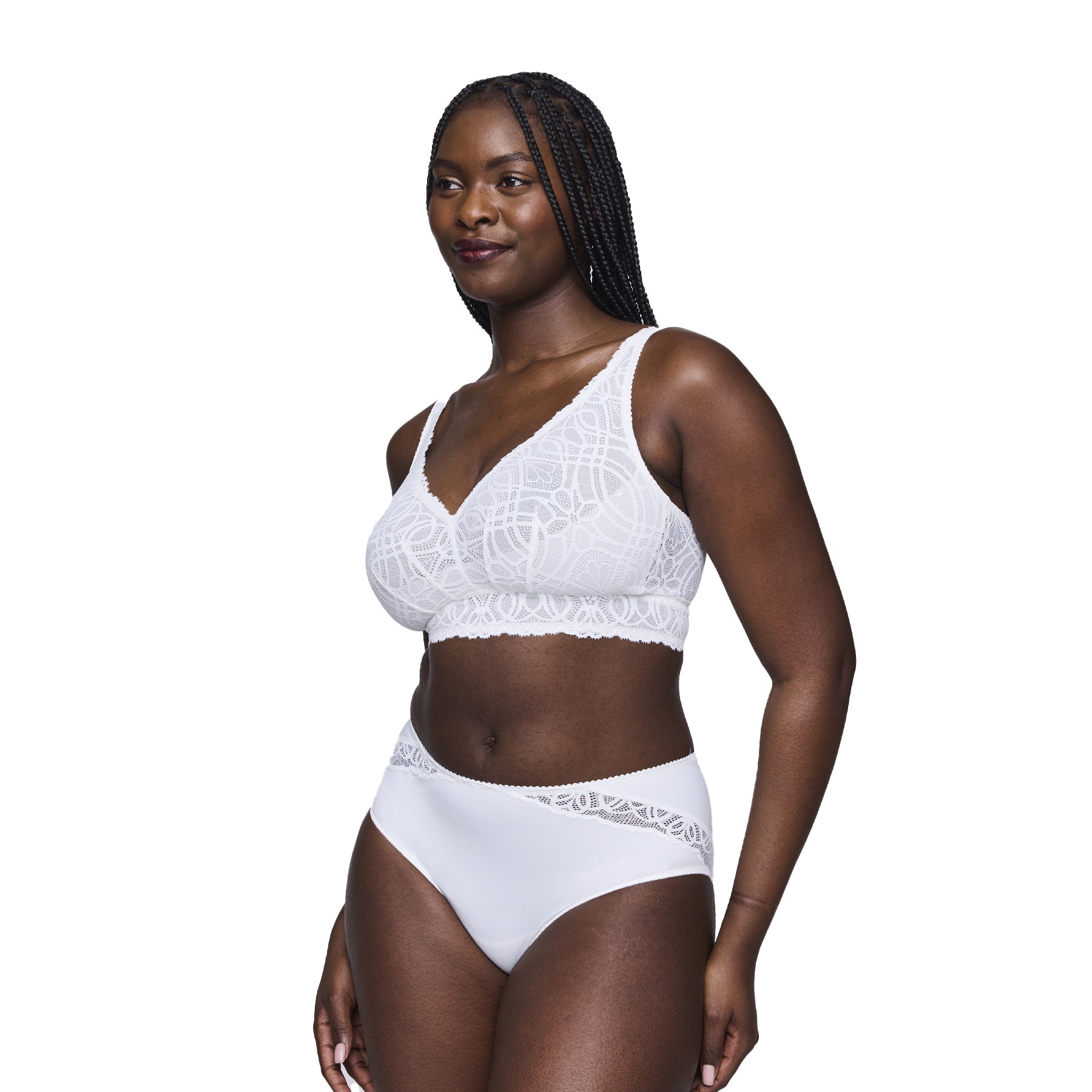 Front view of a woman wearing a matching white lace bralette and high-waist panty set, smiling confidently.