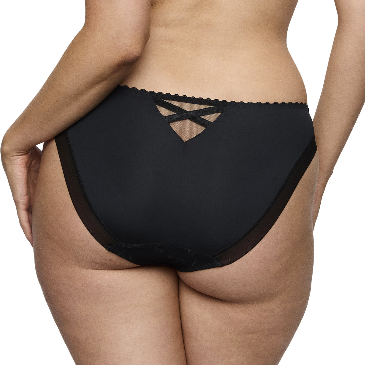 Back view of model wearing PrimaDonna Solisse Rio Brief in black with full coverage and criss-cross detail at the waist.