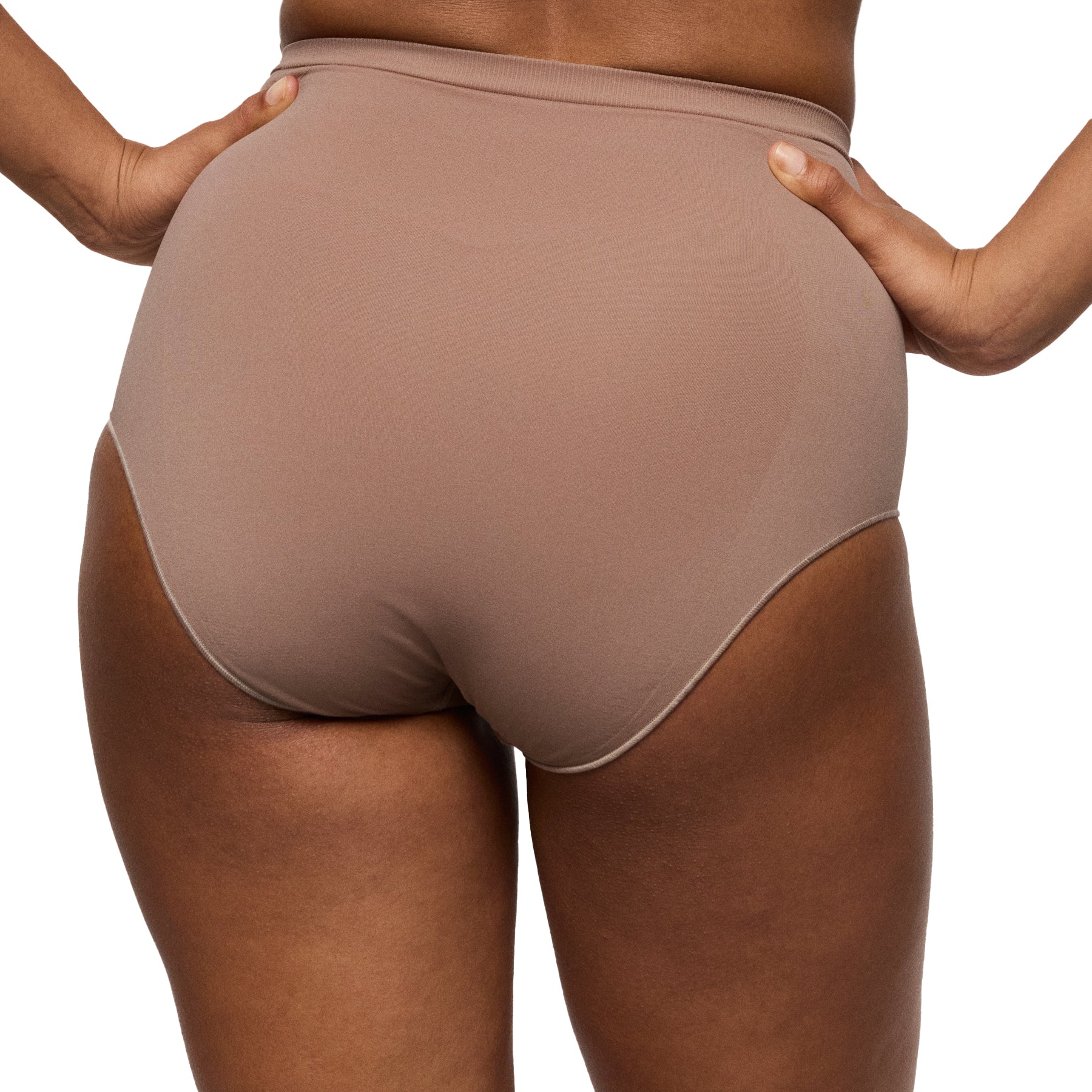 Back view of high-waisted seamless shaping brief in warm nude tone with full coverage