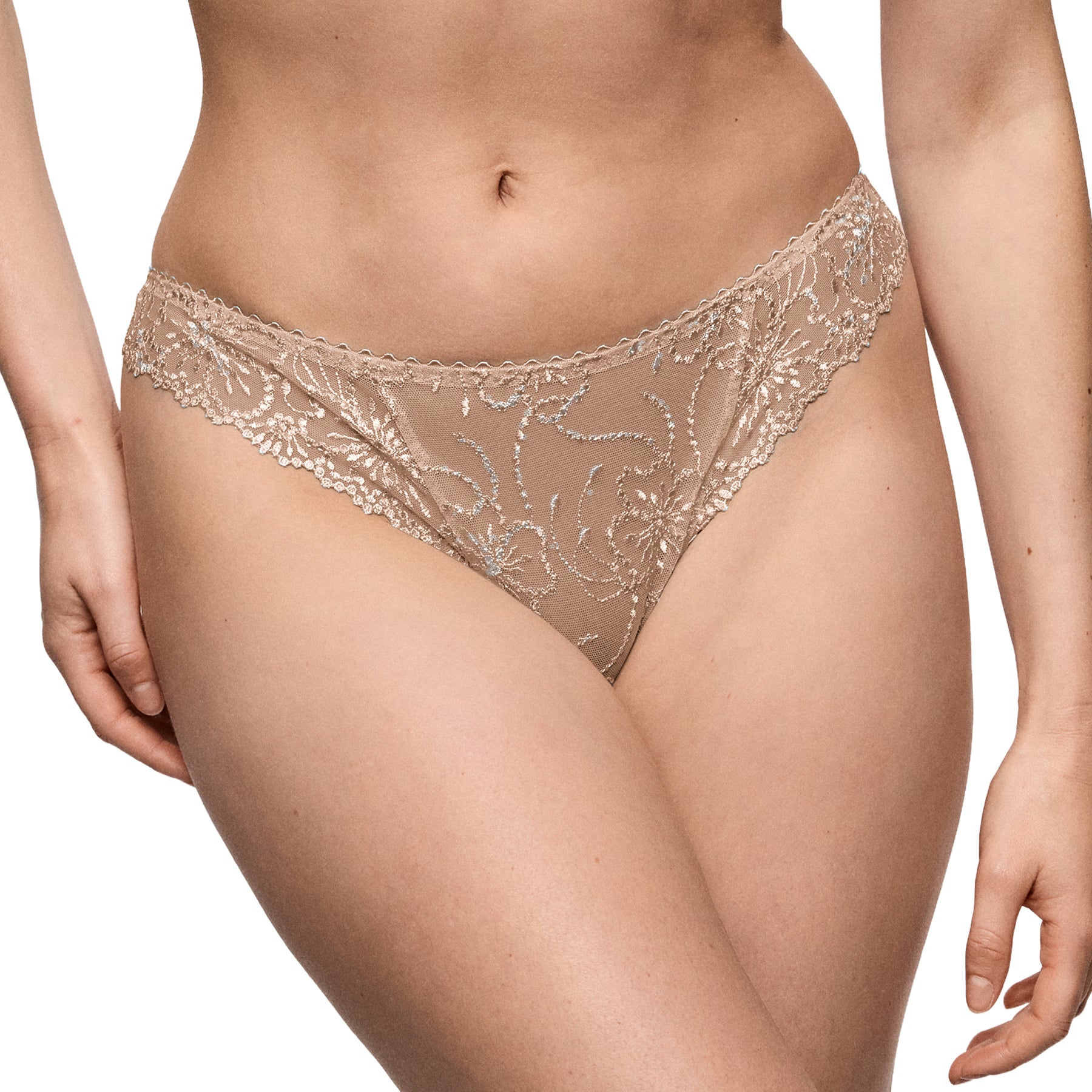 Model wearing the Marie Jo Jane thong in Sand showcasing intricate floral embroidery, soft stretch lace, and a flattering low-rise fit.