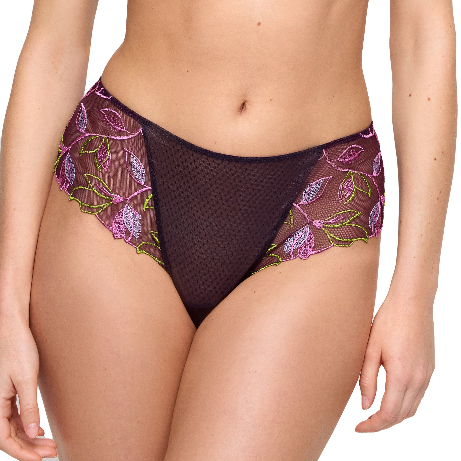 Model wearing online-exclusive plum brief with sheer mesh and bright floral embroidery across the hips