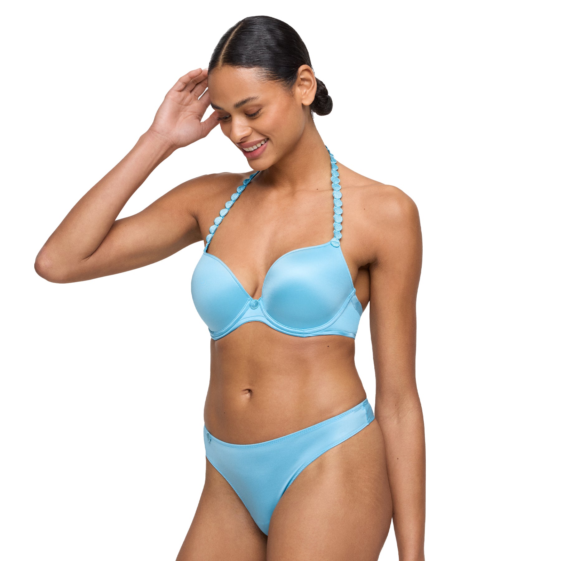 Woman wearing a matching light blue padded bra with decorative straps and a coordinating thong.