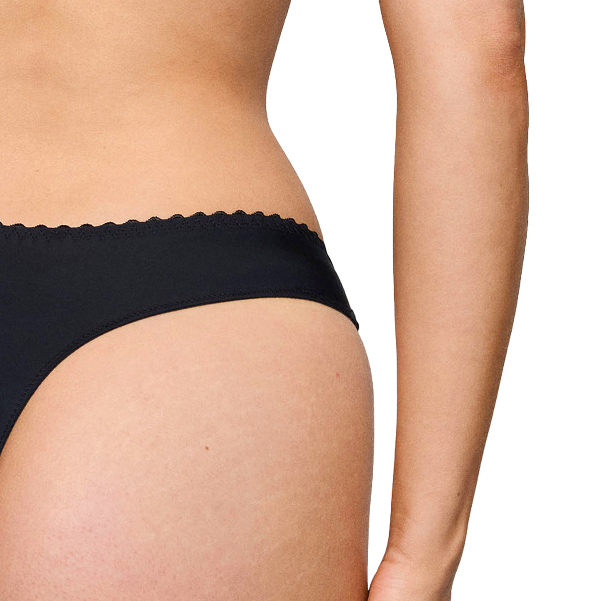 Back view of the PrimaDonna Solisse Thong in black, featuring a smooth minimal-coverage design.