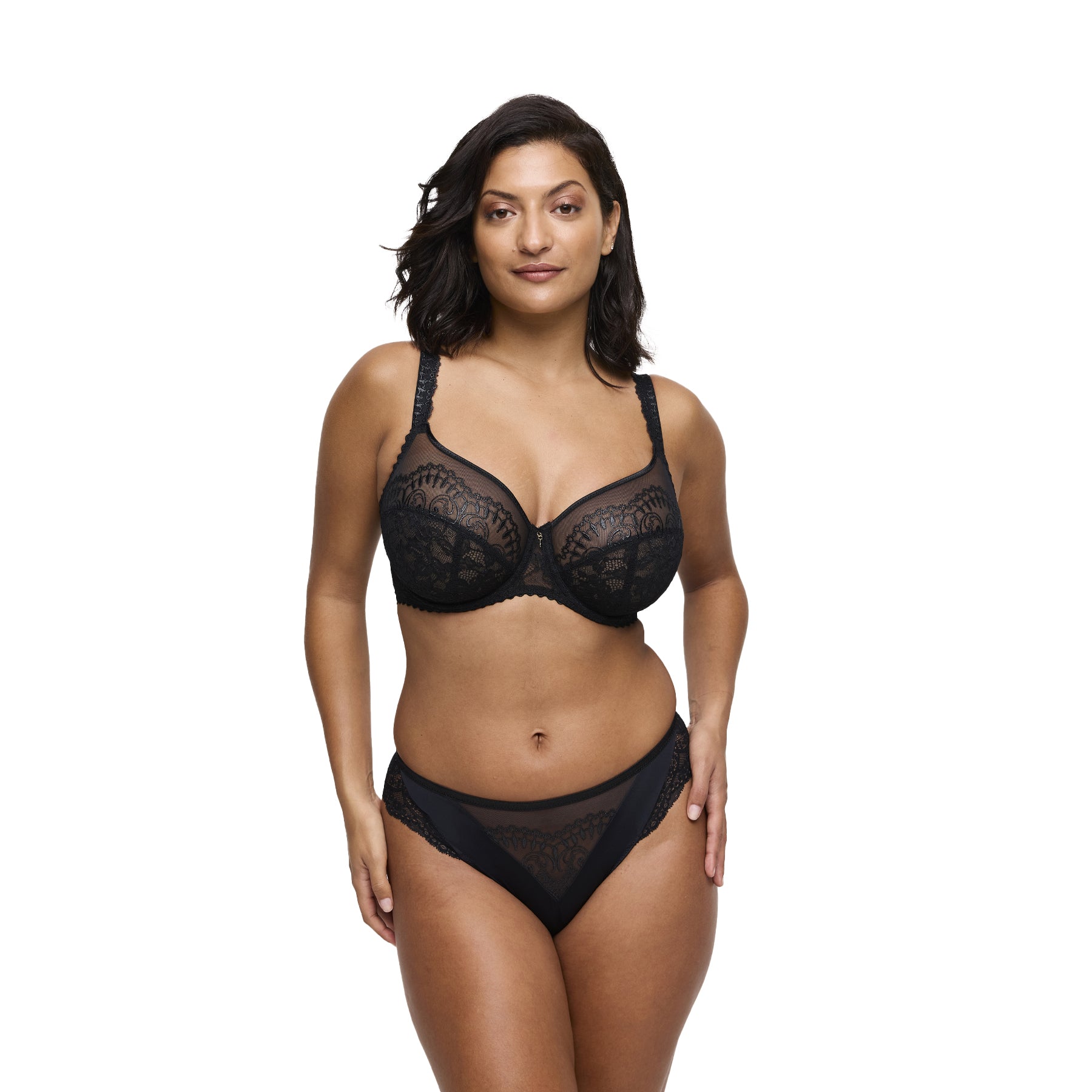 Woman wearing black lace bra and matching lace brief set, full front view.