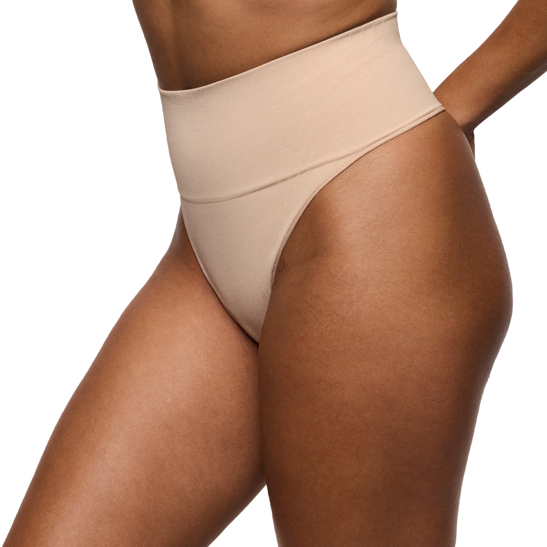 Beige high-waisted underwear worn by a person on a white background