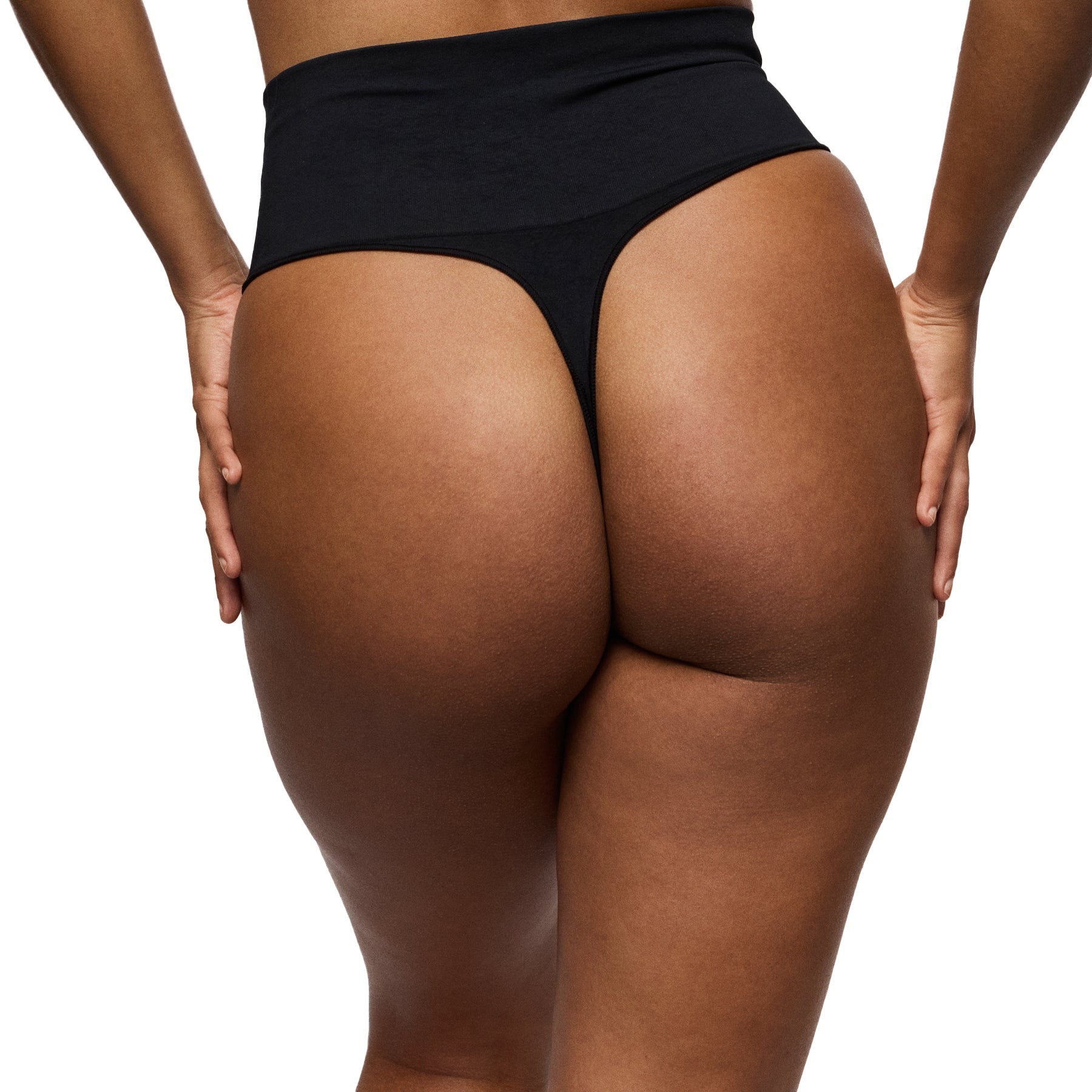 Person wearing black underwear on a white background