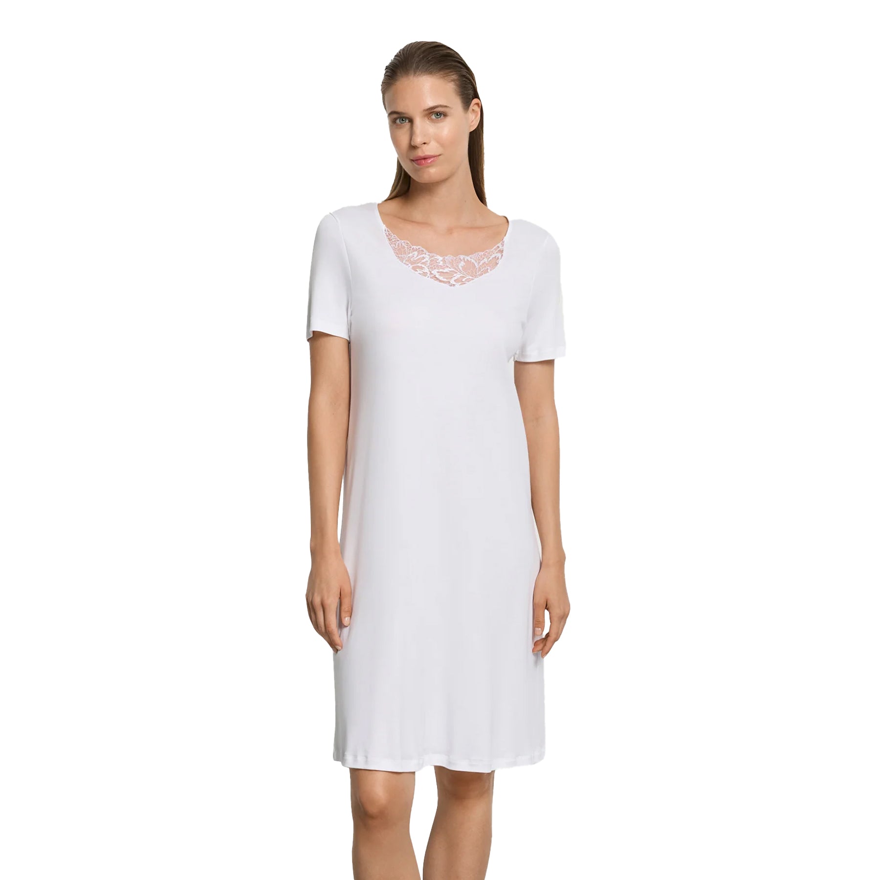 Model wearing white knee-length nightgown style 074746 featuring soft stretch fabric and lace inset neckline.