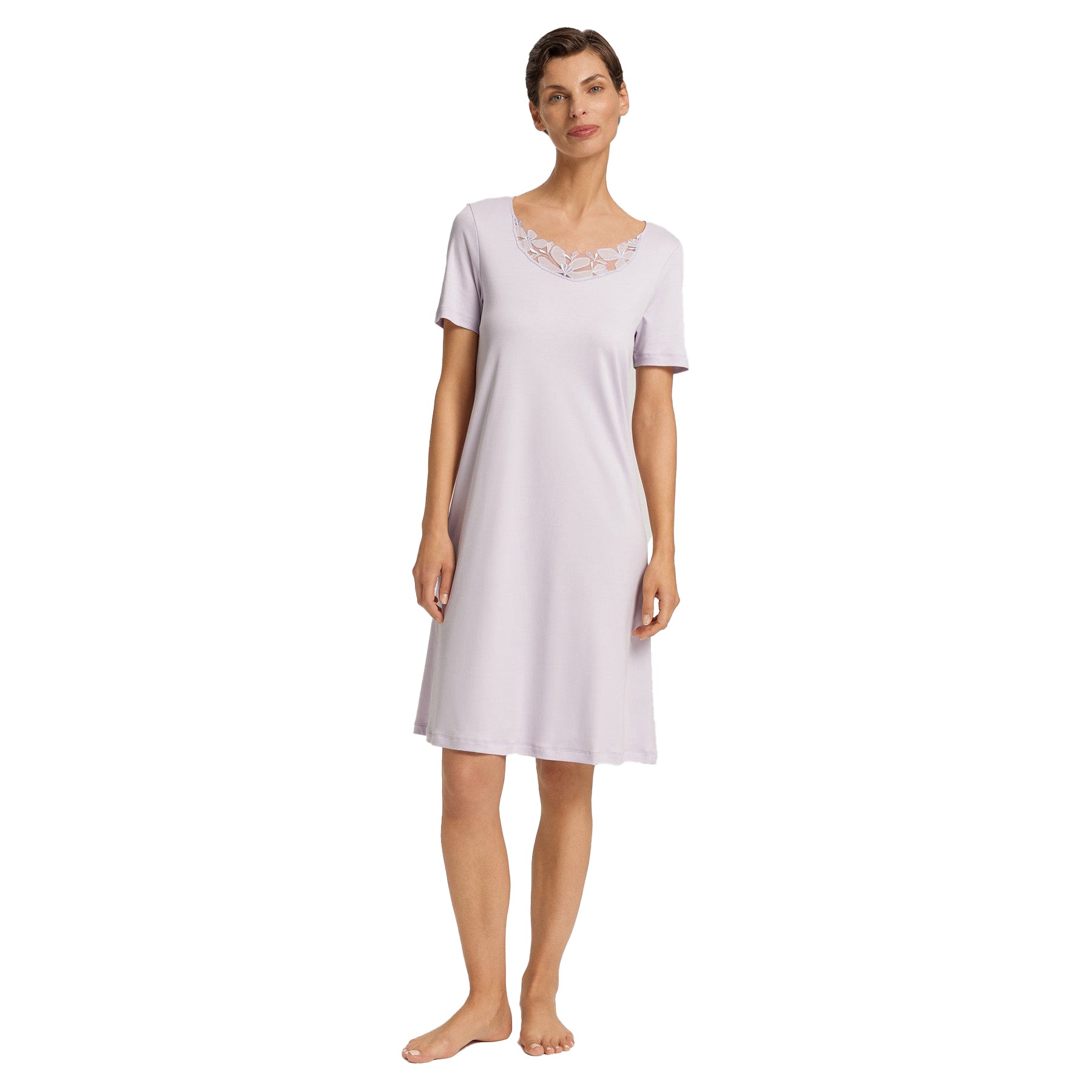 Woman wearing lavender Hanro nightgown with short sleeves and floral lace neckline, front view.