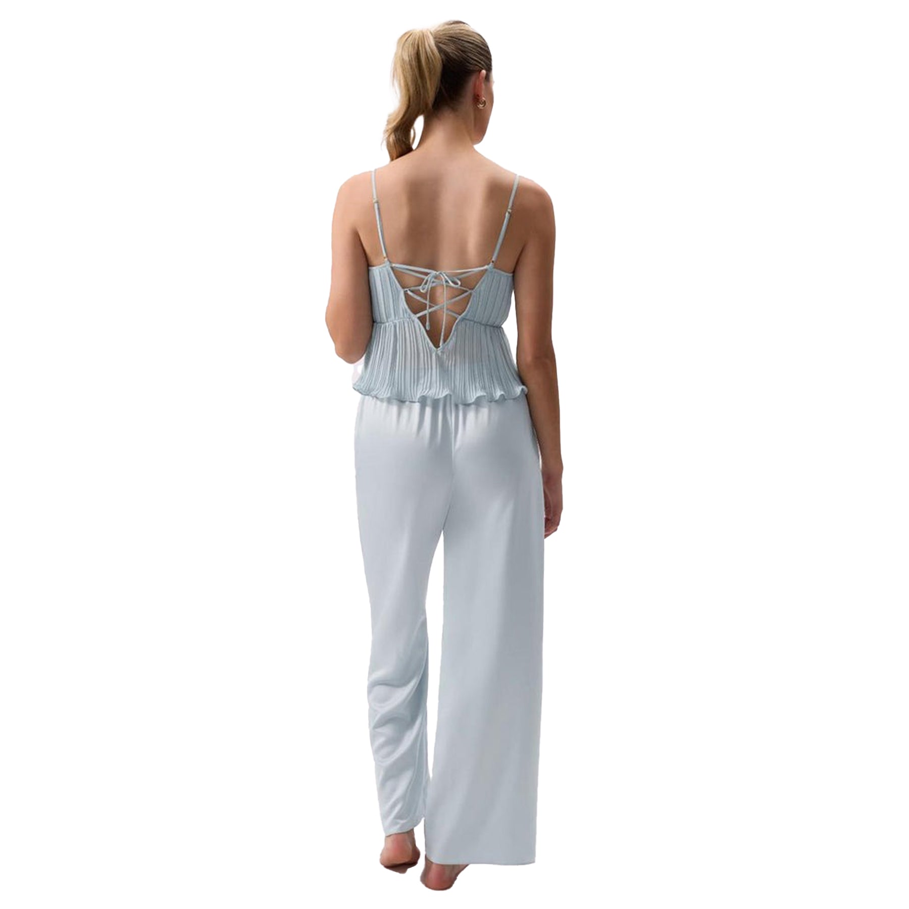 Back view of light blue camisole pajama set with lace-up detail and satin pants.