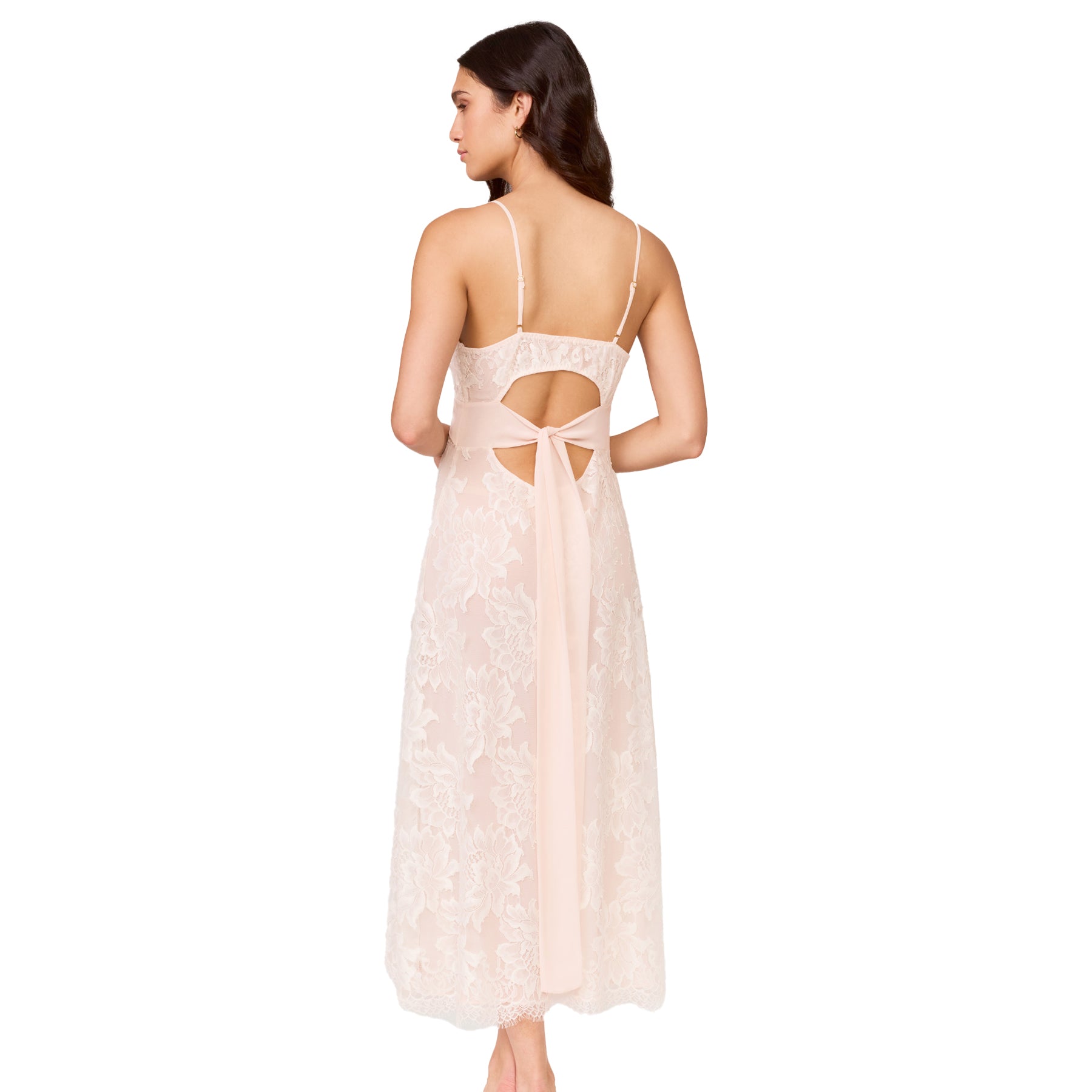 Back view of blush lace bridal gown with open-back cutout and long chiffon tie, shown on model against a white background.