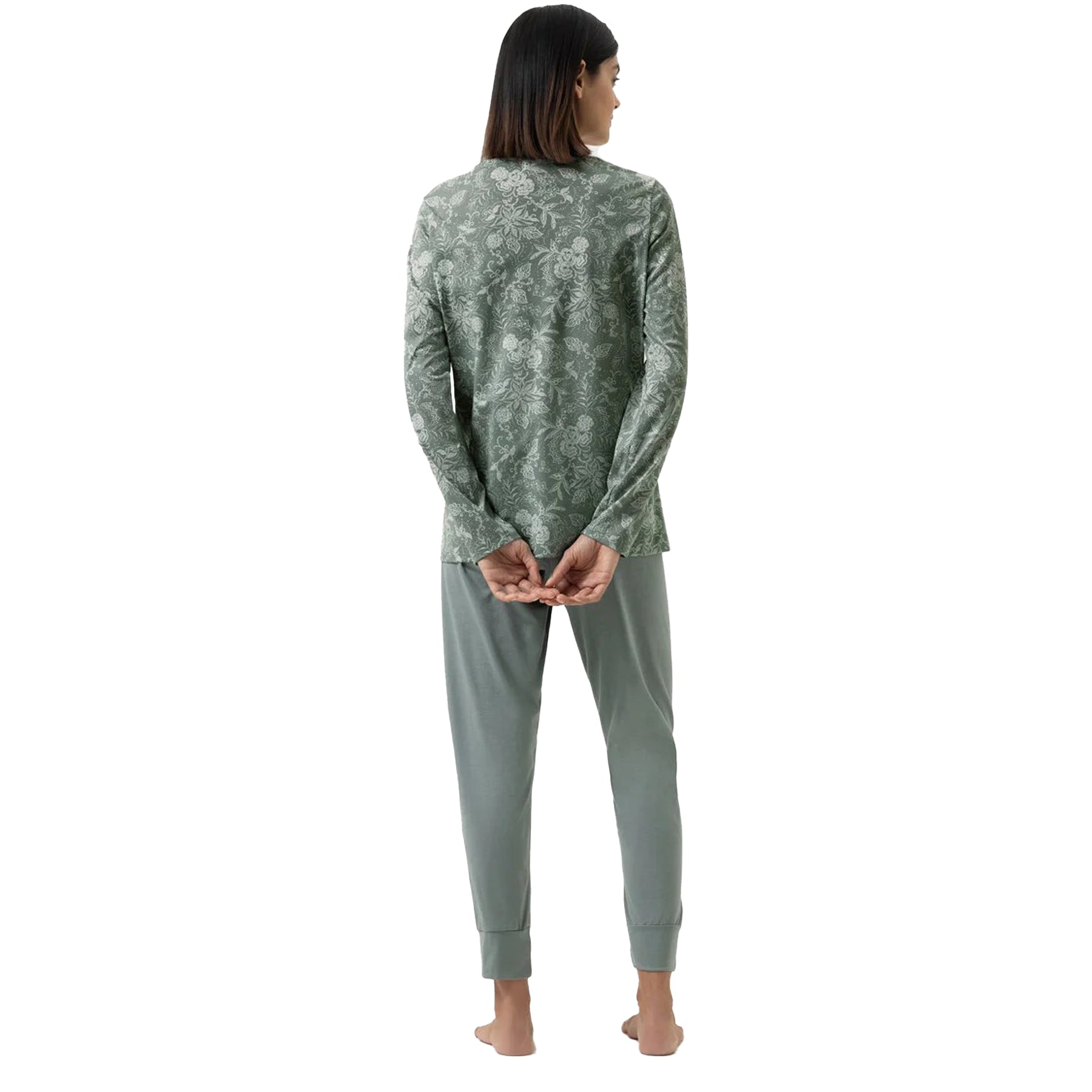 Back view of model in sage green pyjama set with floral long-sleeve top and cuffed pants.