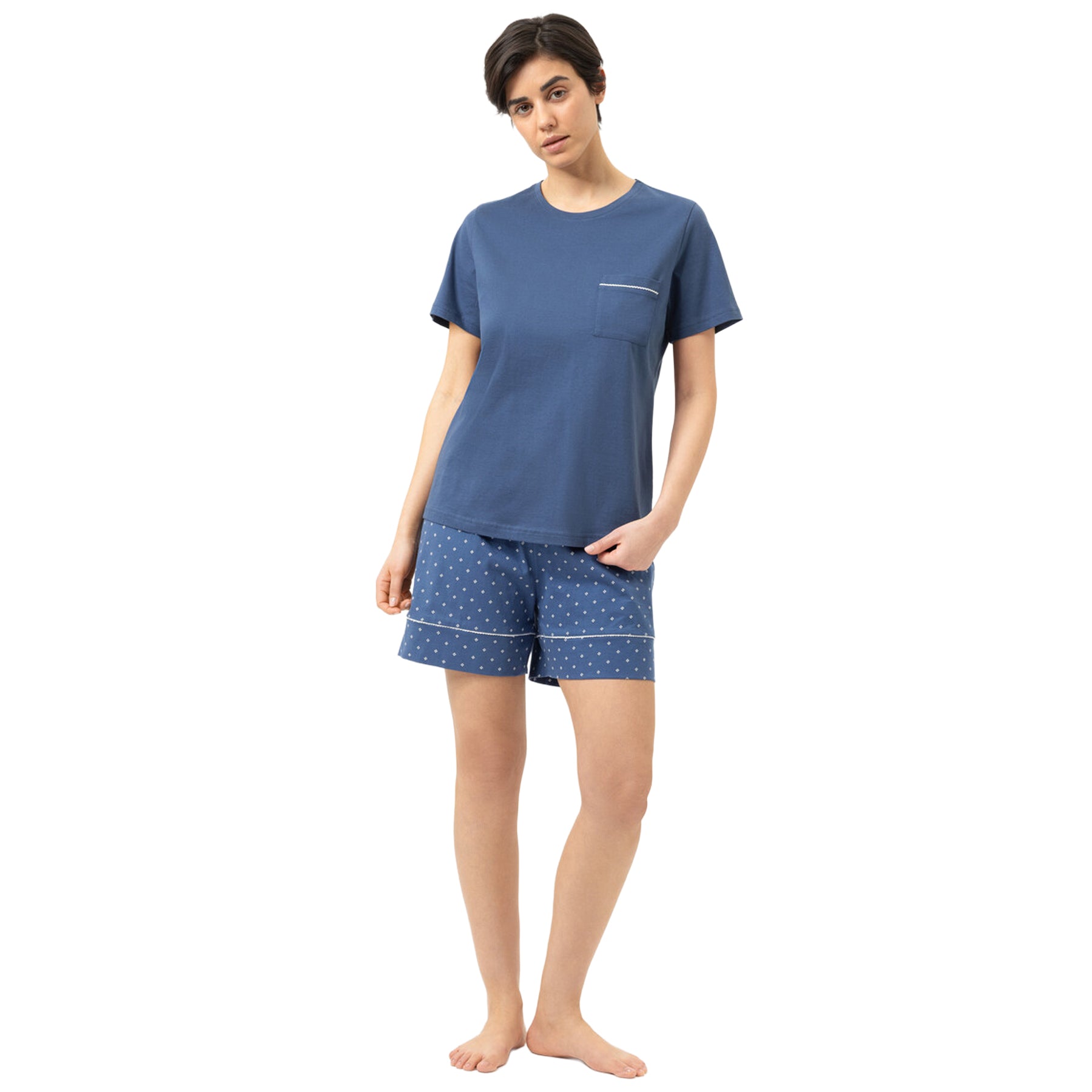 Mey Midnight Dust short sleeve pajama set with blue crew neck T-shirt, matching geometric print shorts, and chest pocket detail, front view on model.